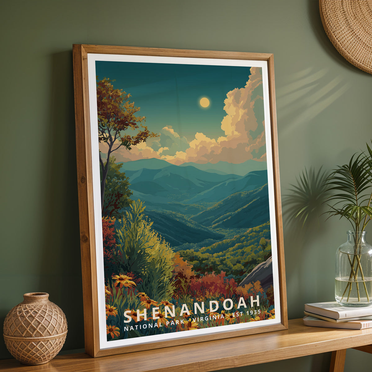 Framed Shenandoah National Park retro print on a wooden sideboard against a sage green wall with vases and books