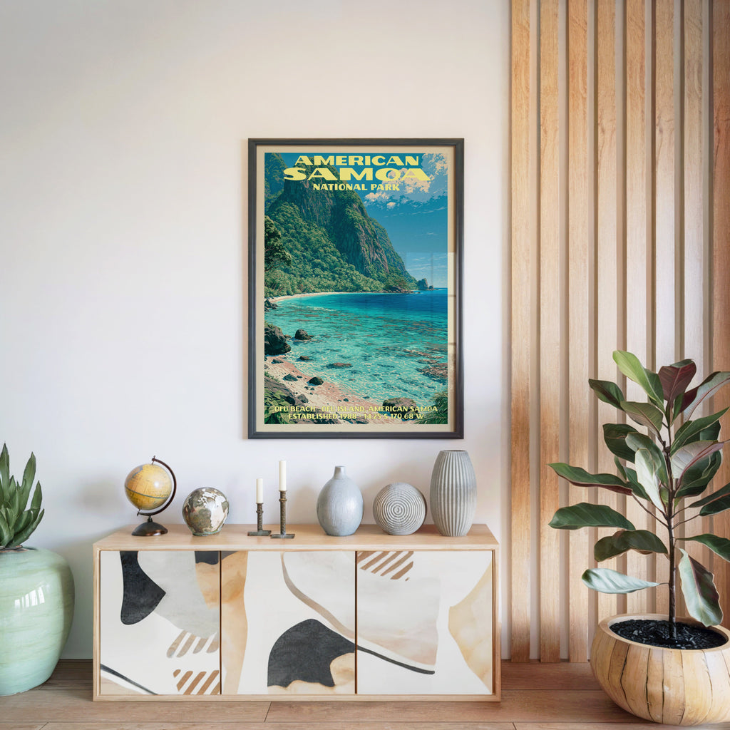 American Samoa National Park poster in a black frame above a light wood sideboard by a slatted wall panel