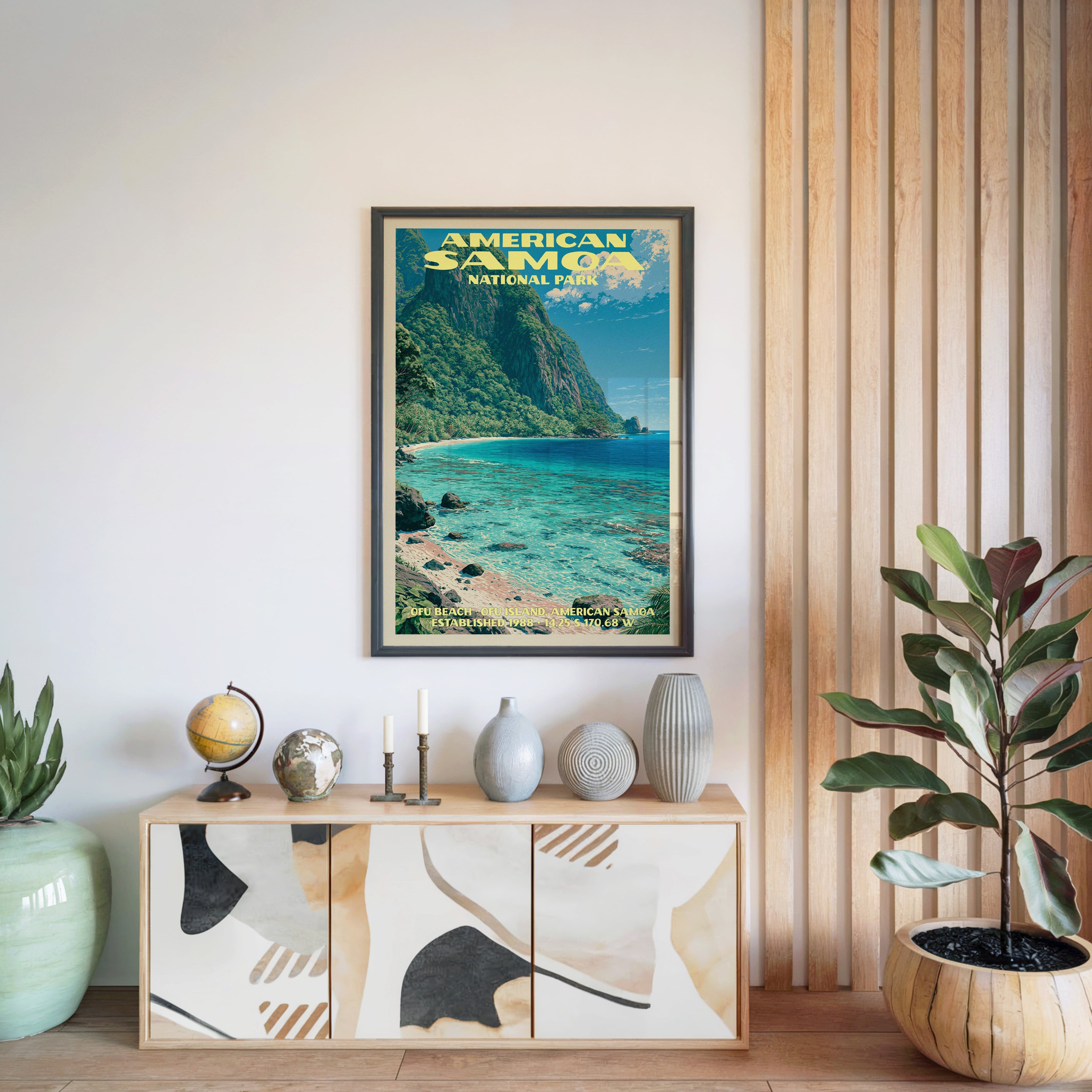 American Samoa National Park poster in a black frame above a light wood sideboard by a slatted wall panel