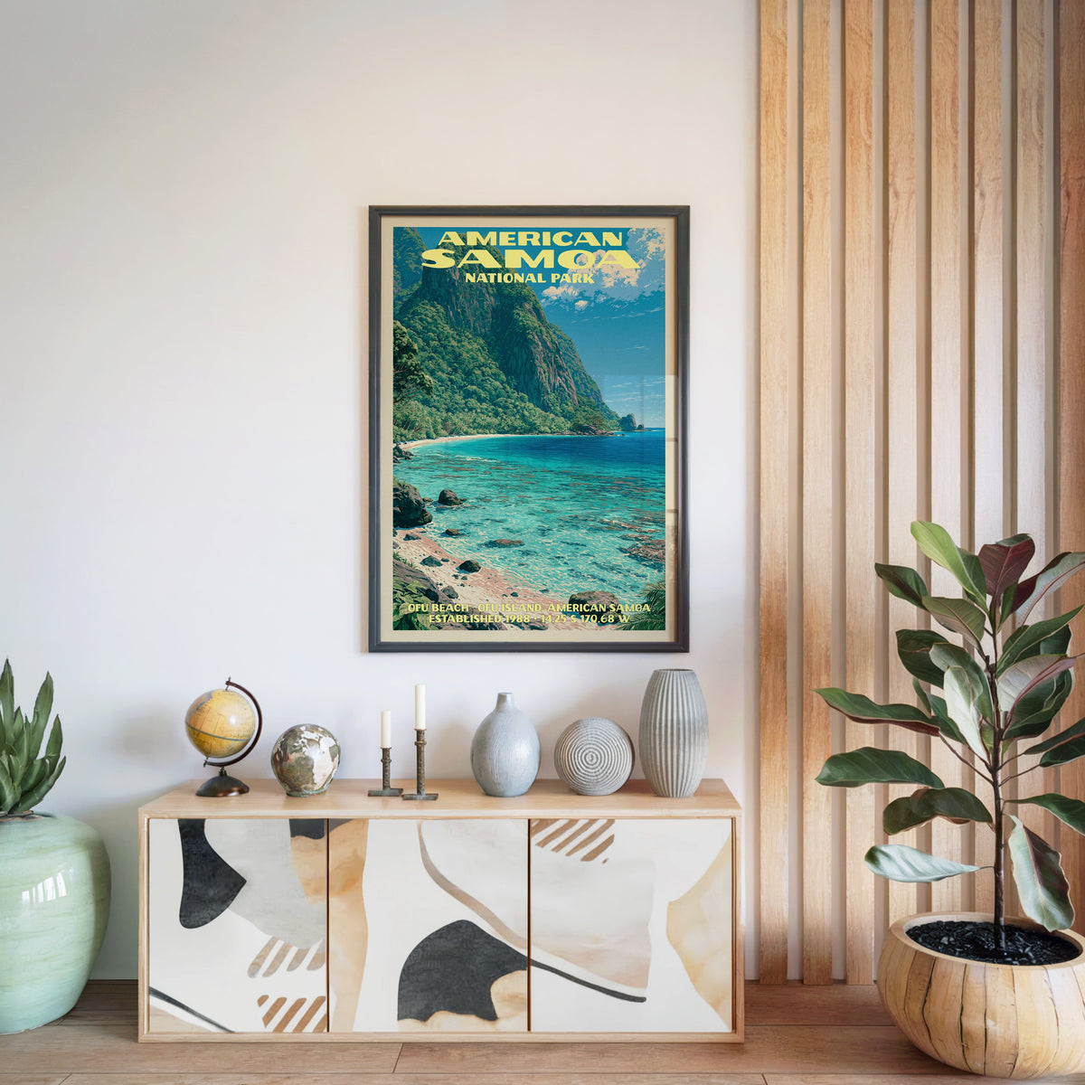 American Samoa National Park poster in a black frame above a light wood sideboard by a slatted wall panel