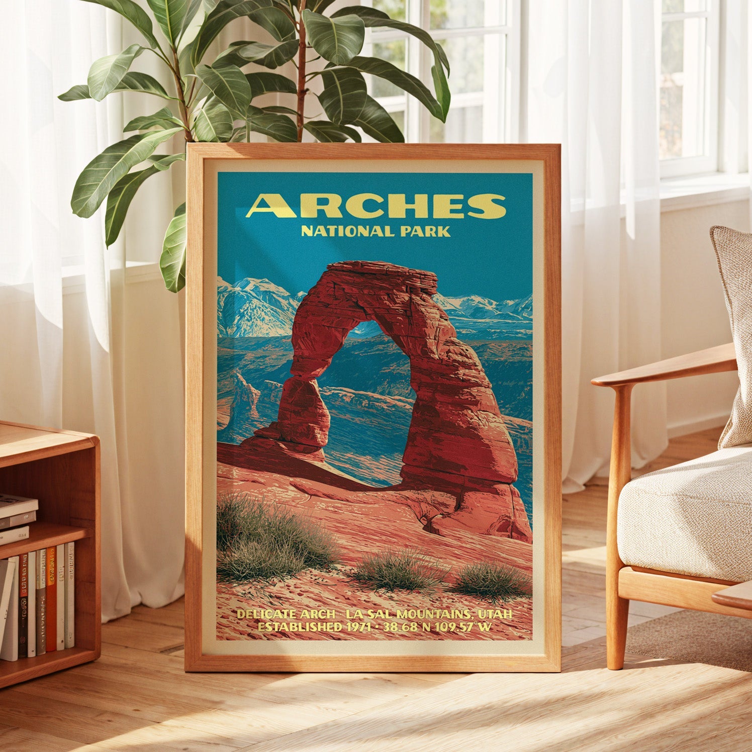 Arches vintage poster in oak, leaning by a sunlit window with sheer curtains and a low bookshelf