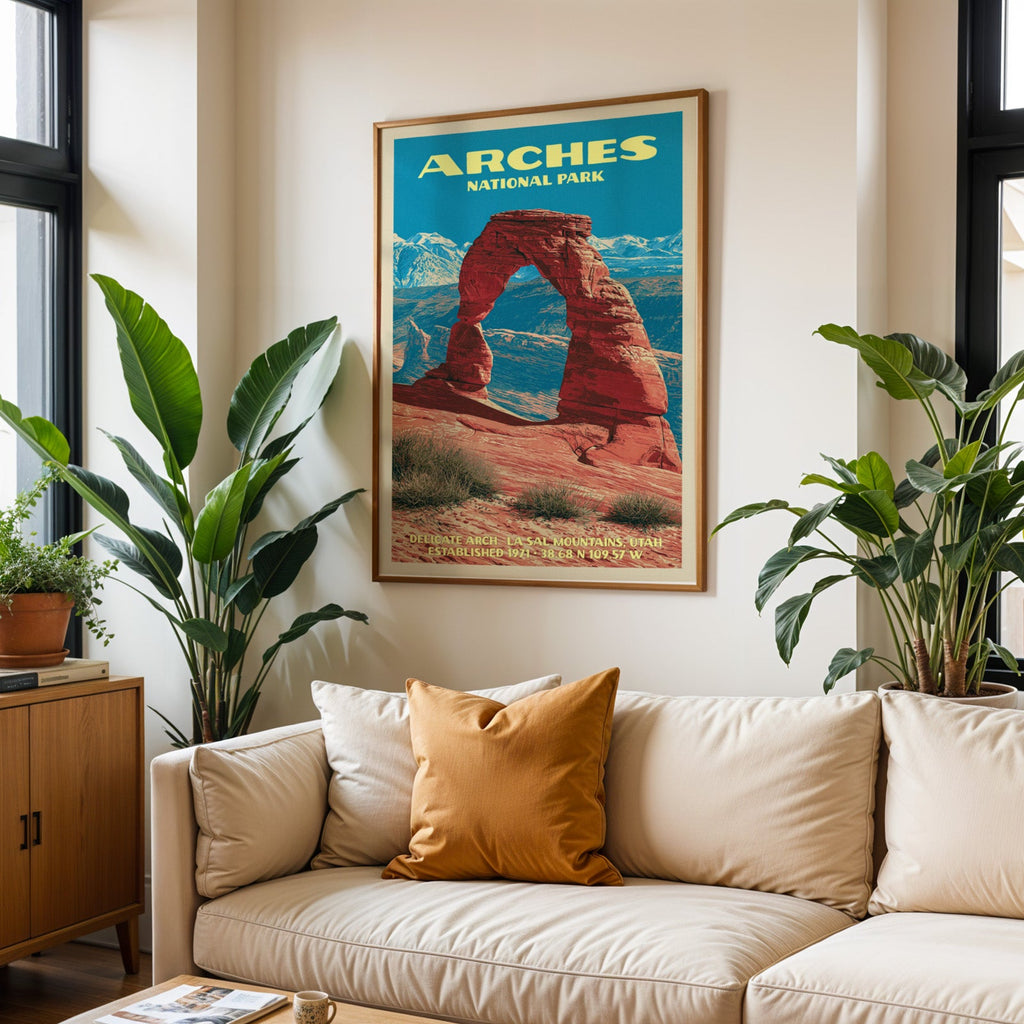 Arches vintage travel print in oak above a cream sofa with a rust cushion and tall houseplants