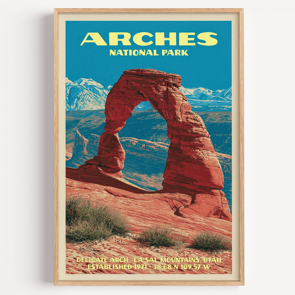 Delicate Arch Arches National Park vintage poster in a light oak frame on a plain white wall
