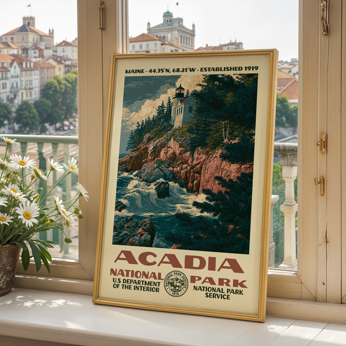 Acadia National Park poster framed on a sunlit windowsill with fresh daisies and a bright view