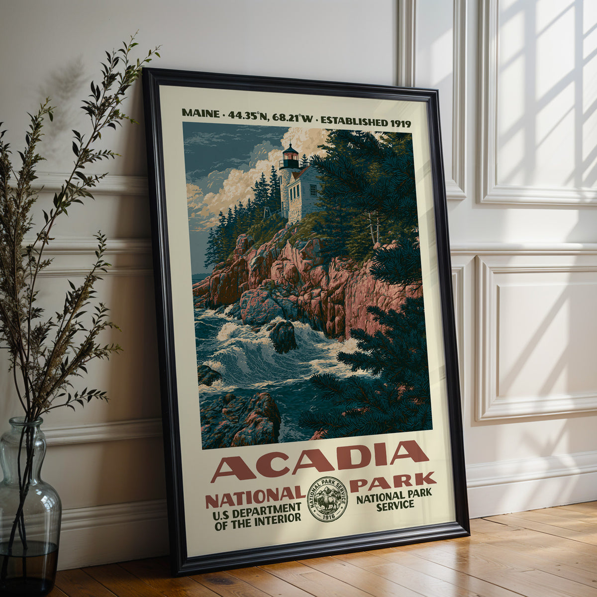 Large Acadia National Park WPA poster in a black frame leaning on a white panelled wall