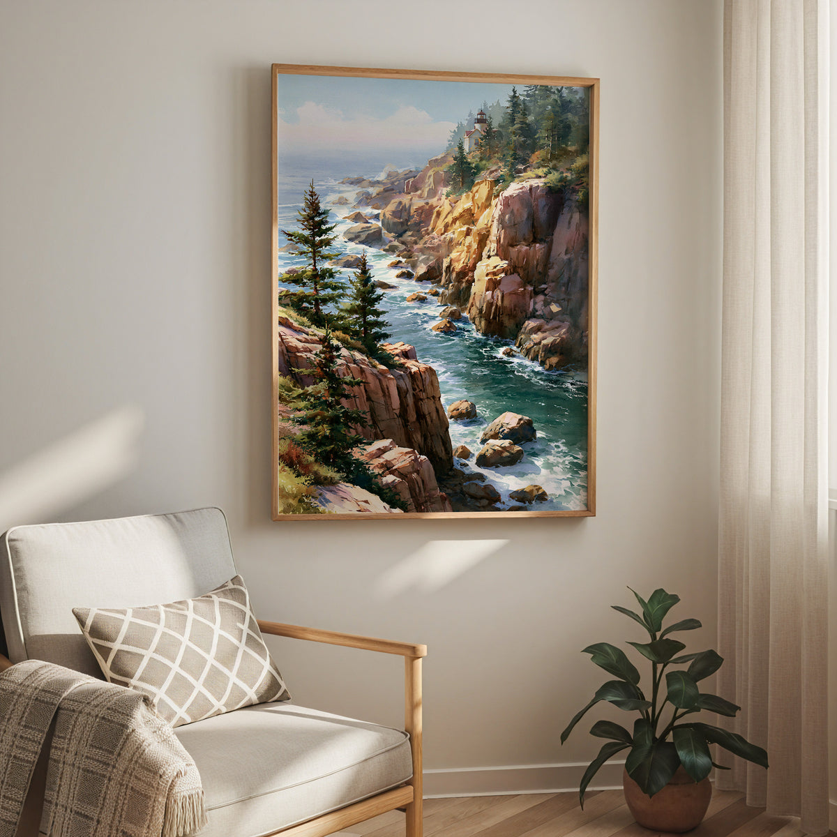Oak-framed Acadia National Park watercolor print hung above a cream armchair in a bright living room