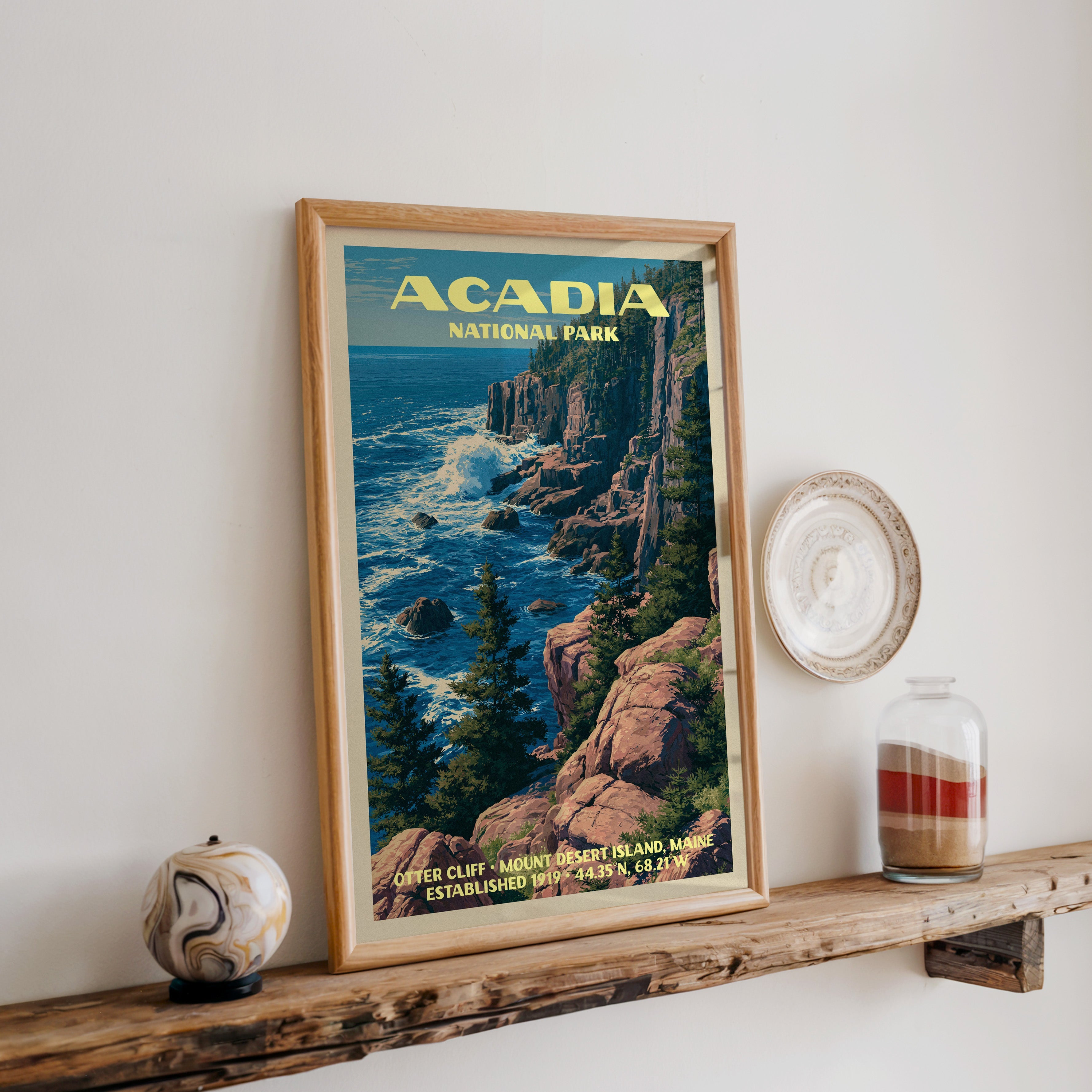 Acadia Otter Cliff print in oak, leaning on a reclaimed wood ledge with a marbled sphere and sand jar