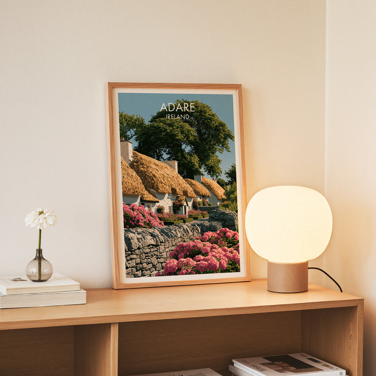 Adare Ireland wall art, slim oak frame standing on an oak console beside a daisy in a glass bottle