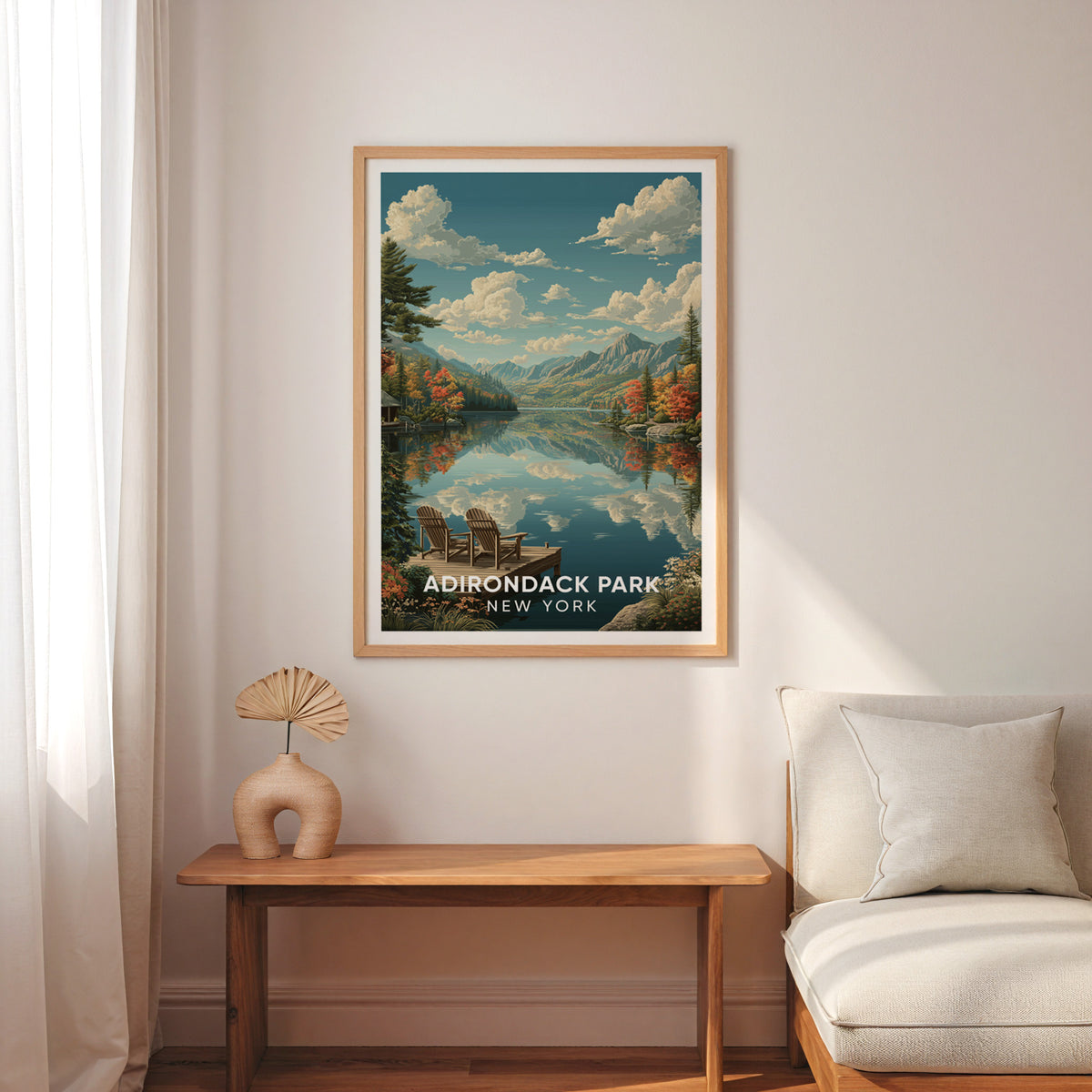 Adirondack lake wall art over a slim wood bench with a cream armchair and sheer curtains