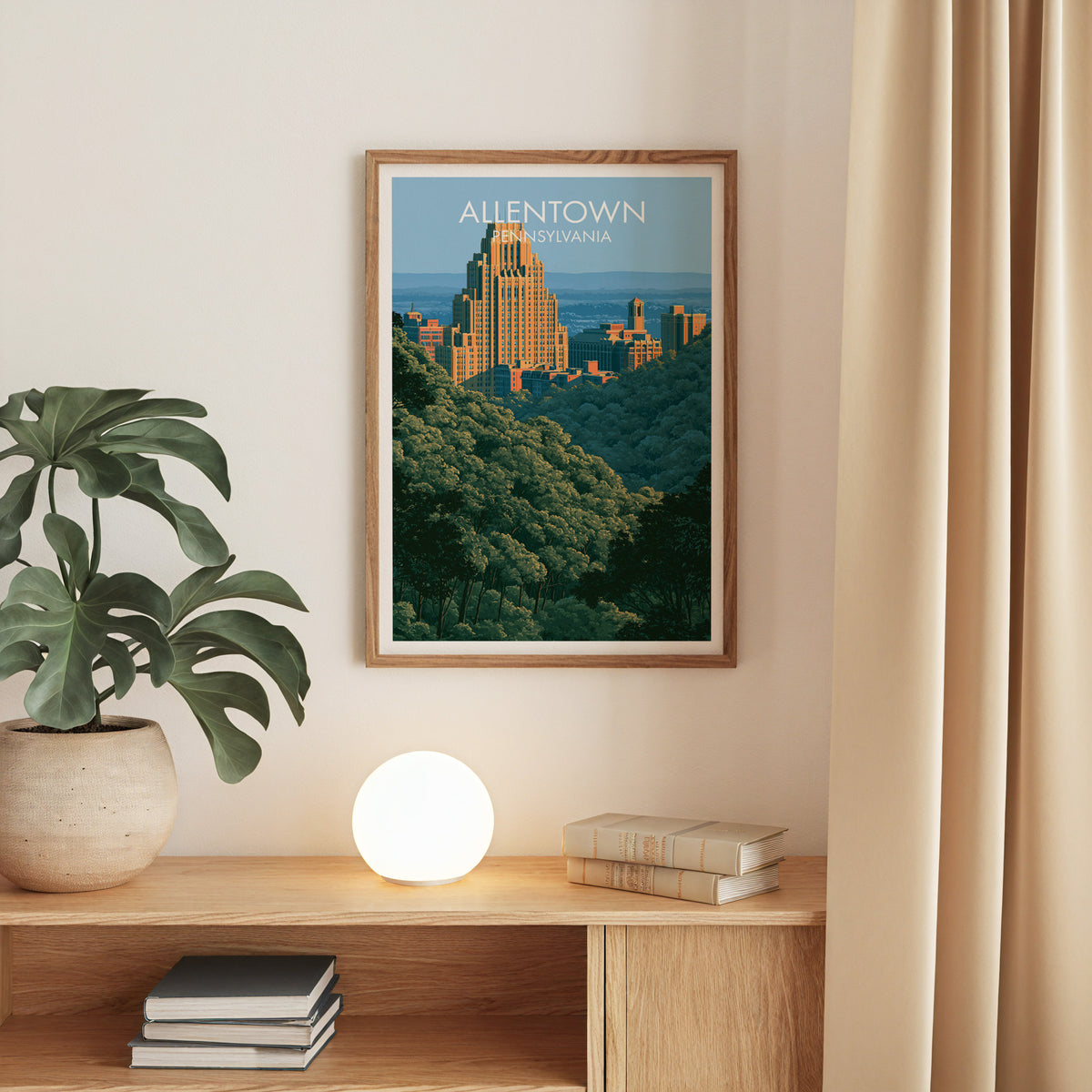 Allentown Pennsylvania art print in an oak frame on a beige wall over an oak console with a monstera.