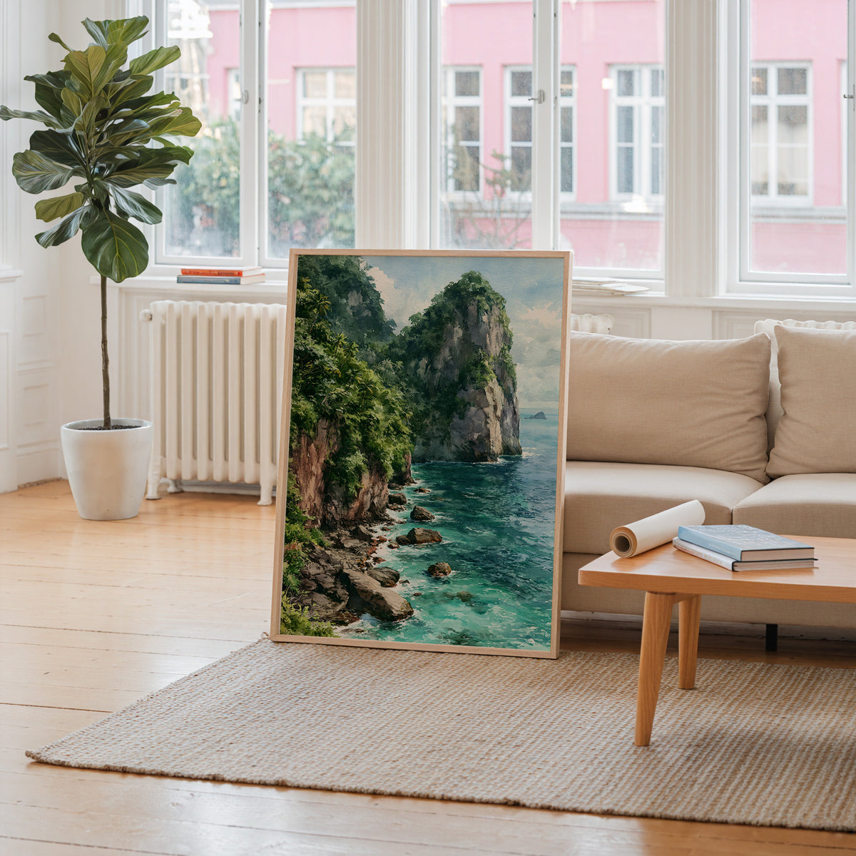 American Samoa National Park watercolor art print leaning against a living room wall beside a linen sofa and coffee table