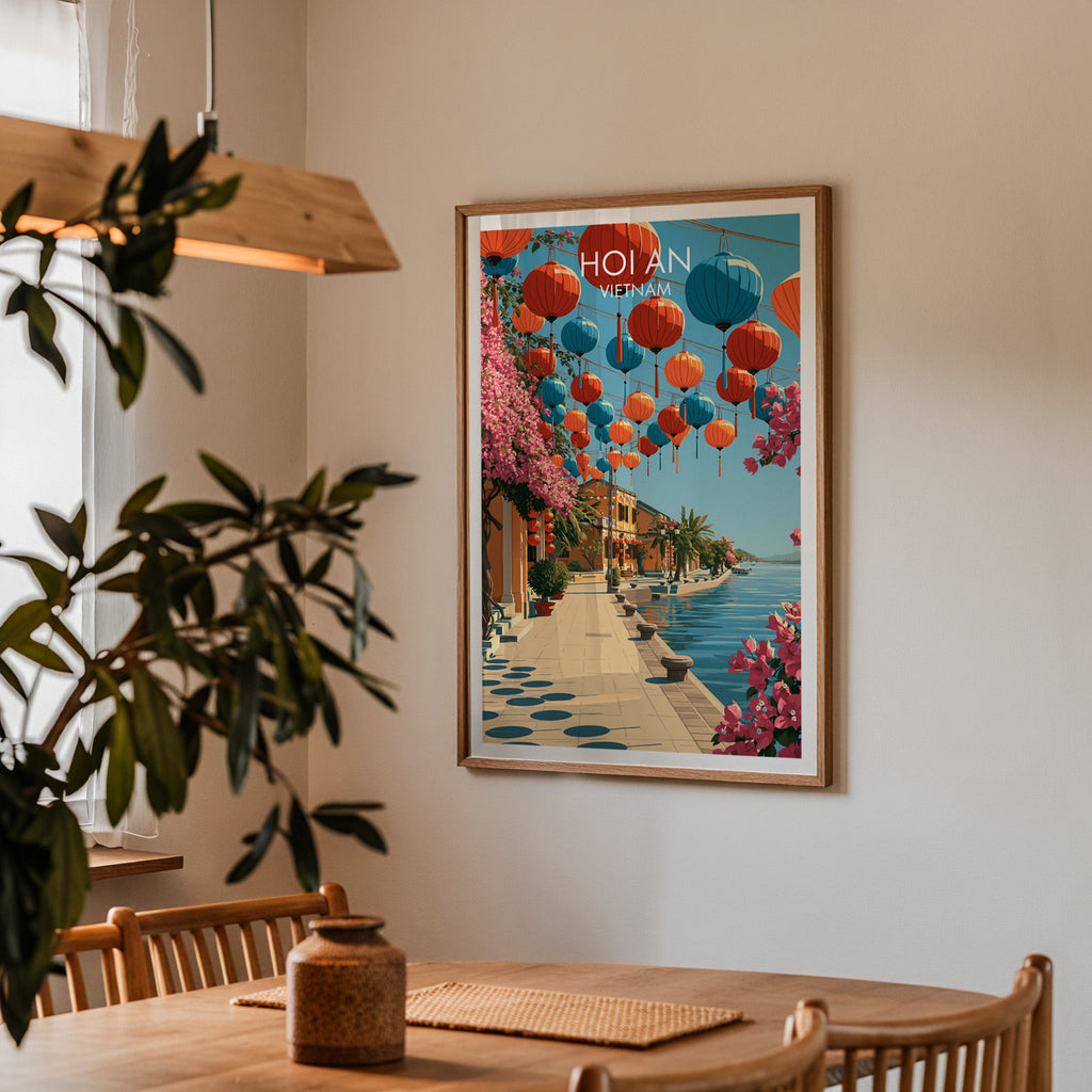 Framed Hoi An Vietnam print on a dining room wall above an oak table in warm afternoon light