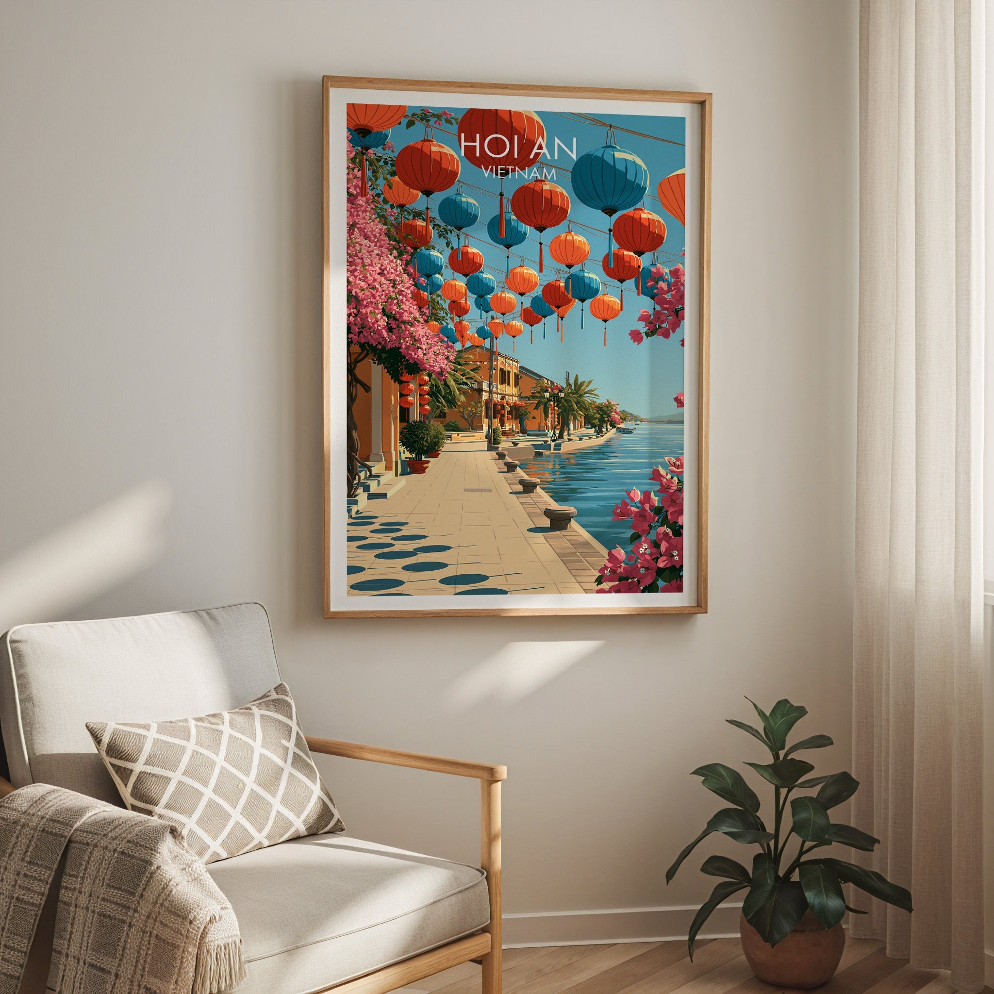 Hoi An lantern travel print in a light oak frame on a living room wall beside a linen armchair
