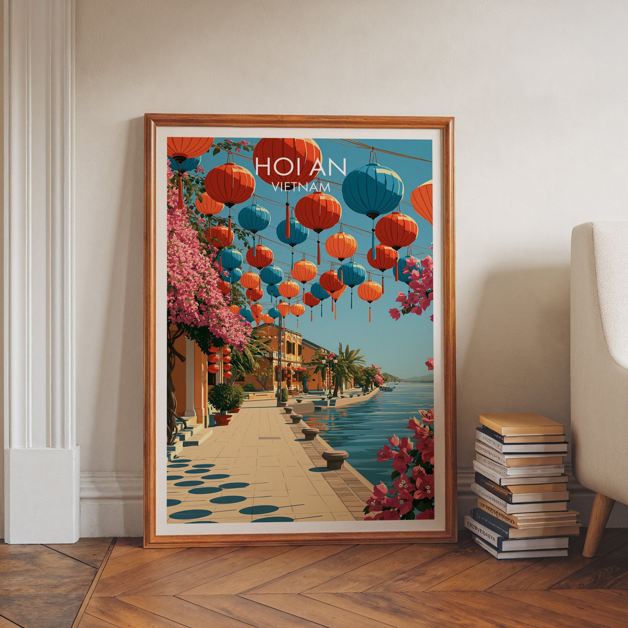 Hoi An Ancient Town art print in a walnut frame leaning in a hallway beside stacked books