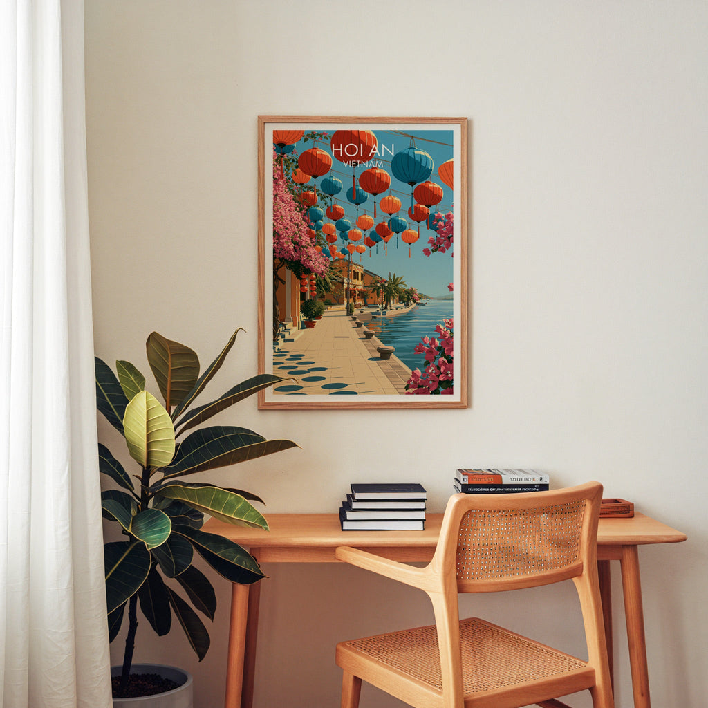 Hoi An Ancient Town wall art above a wooden home office desk with rattan chair and books