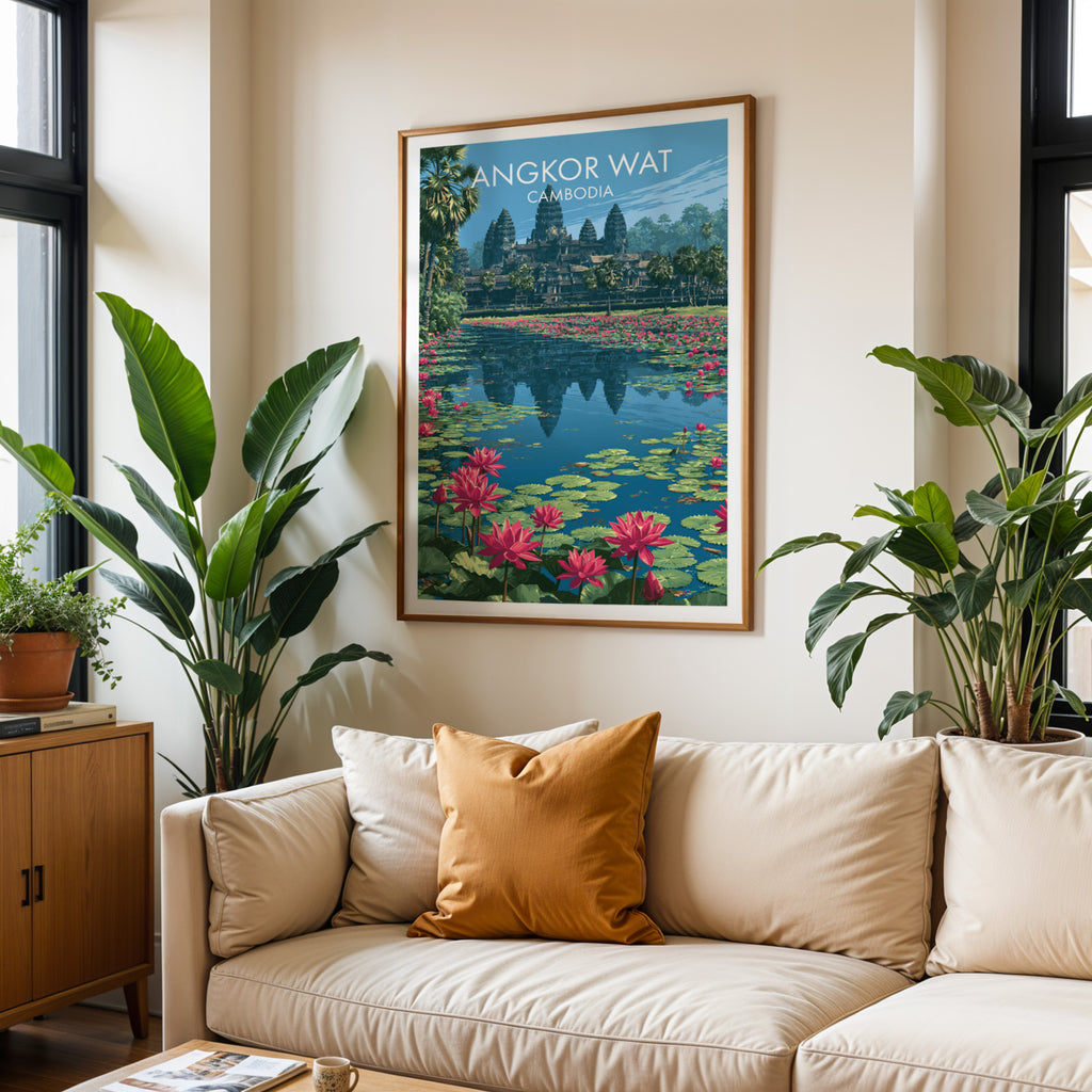 Framed Angkor Wat Cambodia wall art hanging above a cream sofa in a bright living room with tropical plants