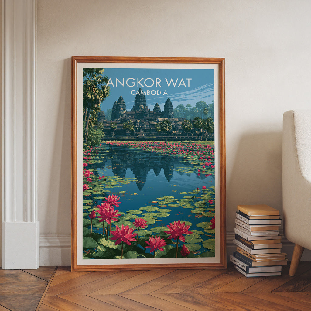Angkor Wat Cambodia art print in a walnut frame leaning in a hallway beside stacked books