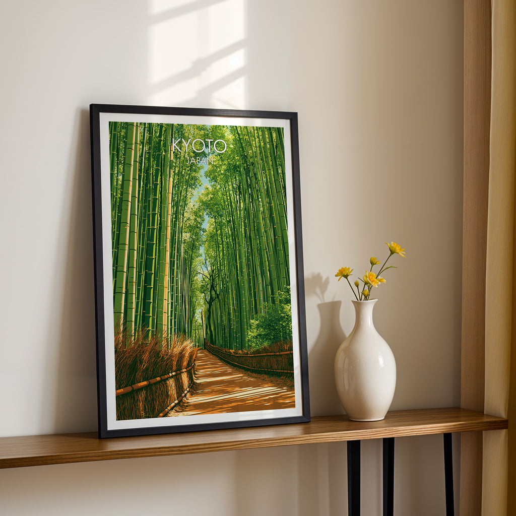 Black framed Arashiyama Bamboo Forest Kyoto print on a narrow hallway console in sunlight, styled with yellow flowers