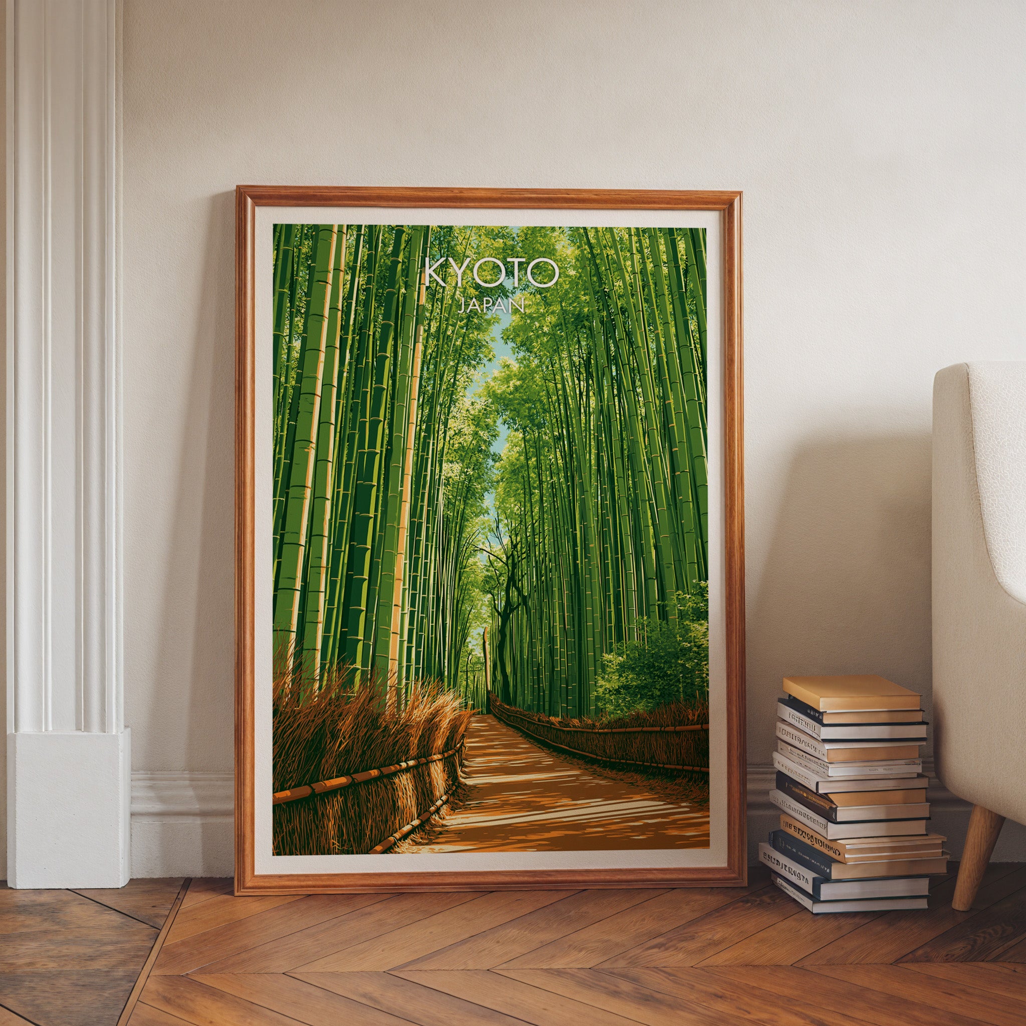 Arashiyama Bamboo Forest Kyoto art print in a walnut frame leaning in a hallway beside stacked books