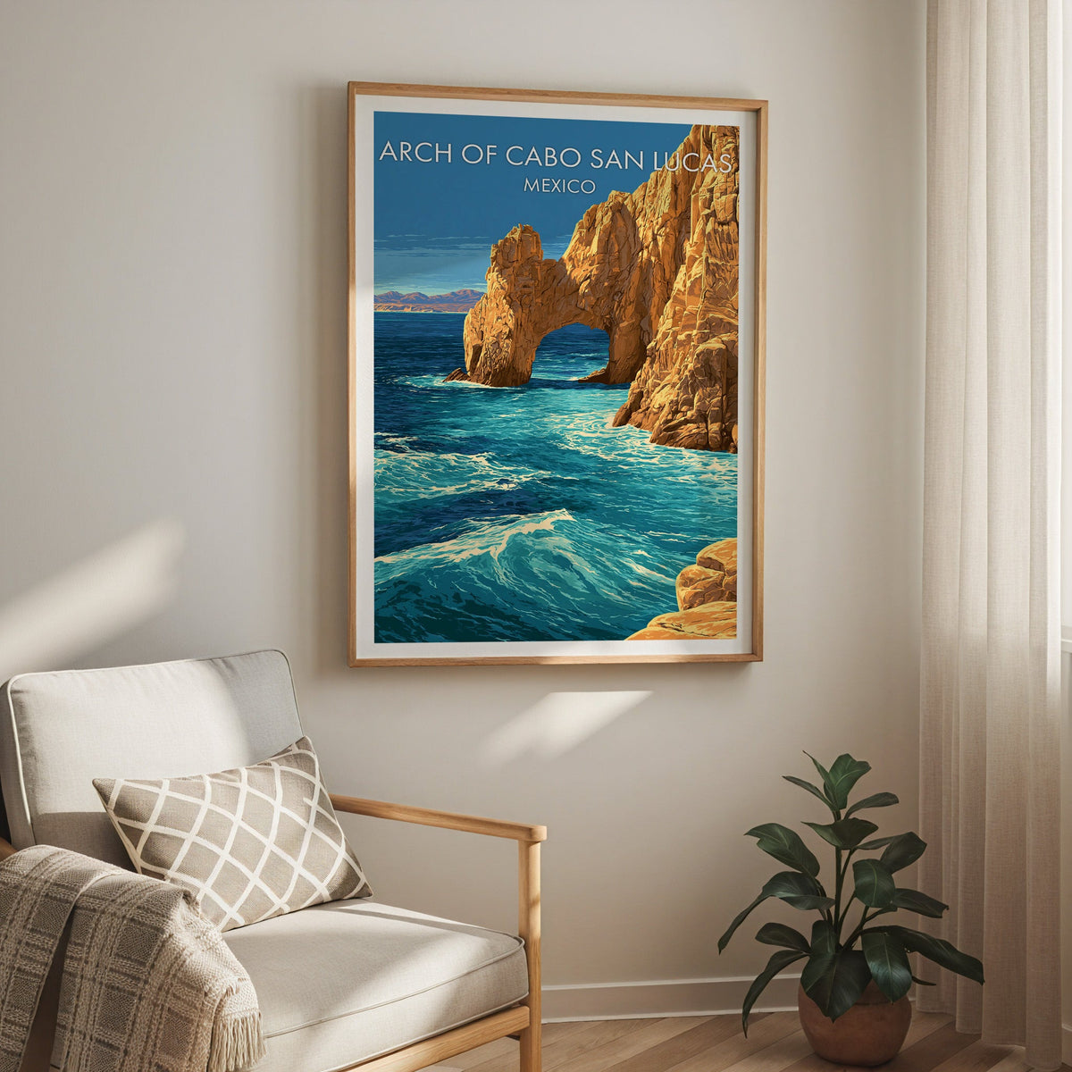 Blue and gold coastline in an oak frame above a cream armchair with a check cushion and sheer curtain