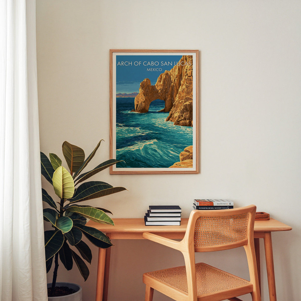 Desert mountains on the horizon, oak frame over a home-office desk with a cane chair and rubber plant