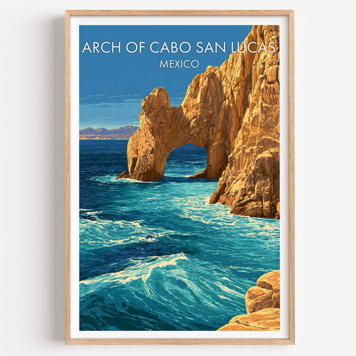 Arch of Cabo San Lucas print in a light oak frame on a plain white wall
