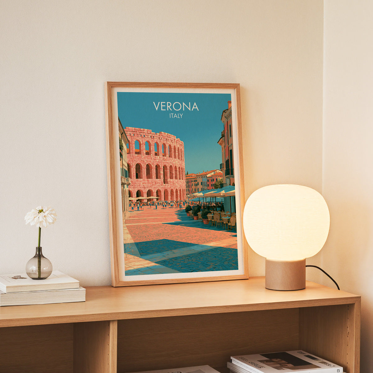 Arena di Verona wall art, slim oak frame standing on an oak console beside a daisy in a glass bottle