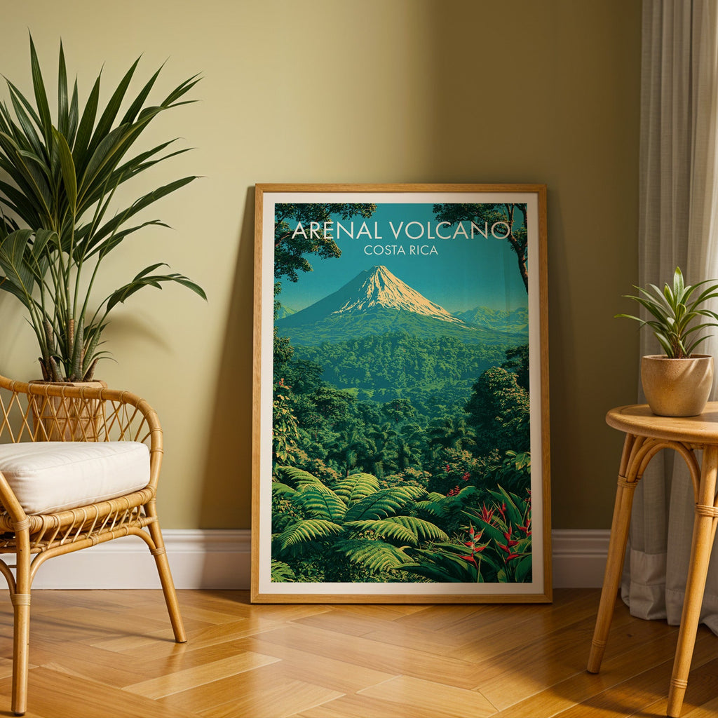 Deep green jungle print in an oak frame leaning on herringbone parquet, rattan chair and cane side table