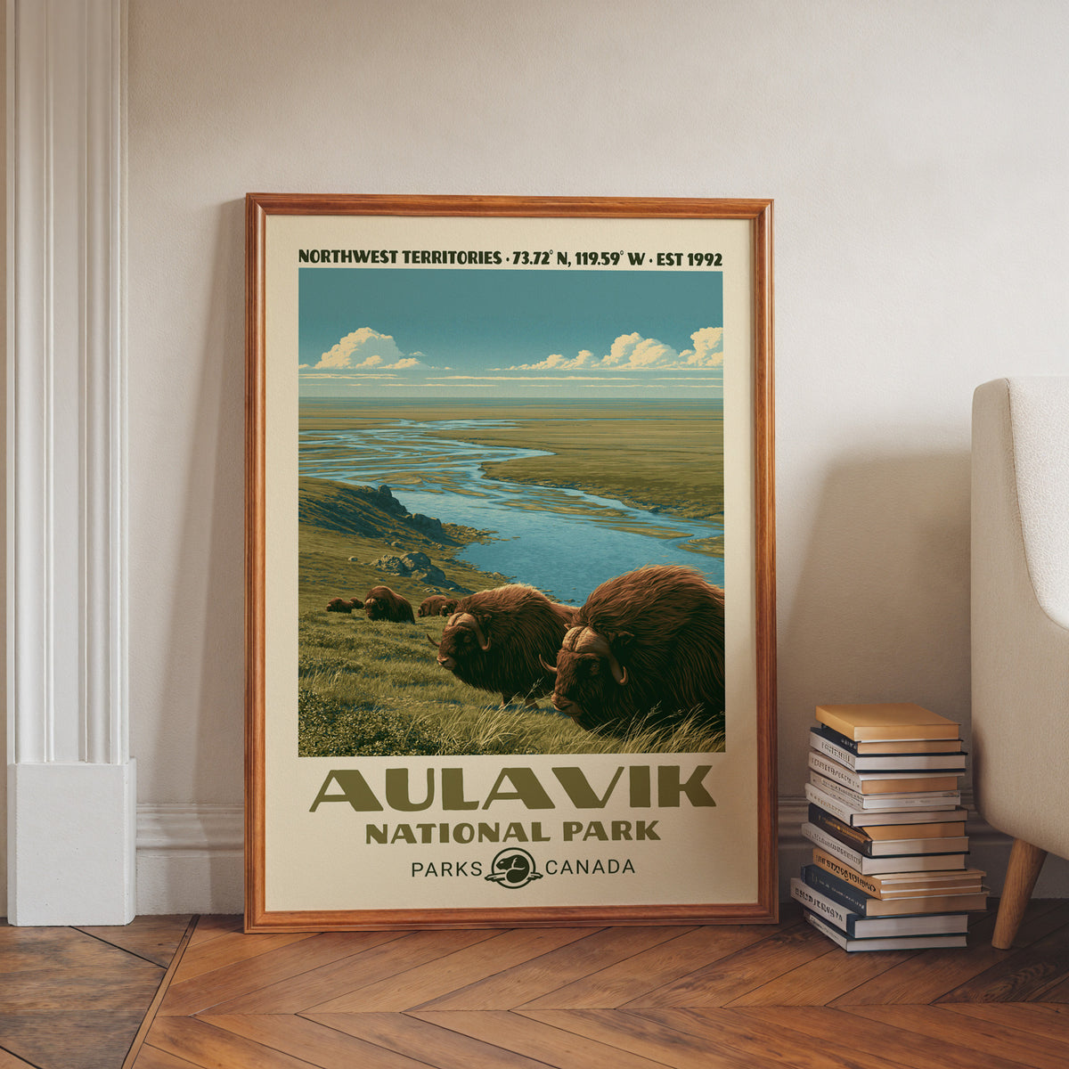 Aulavik National Park wall art, NWT in a walnut frame on a herringbone floor beside stacked books