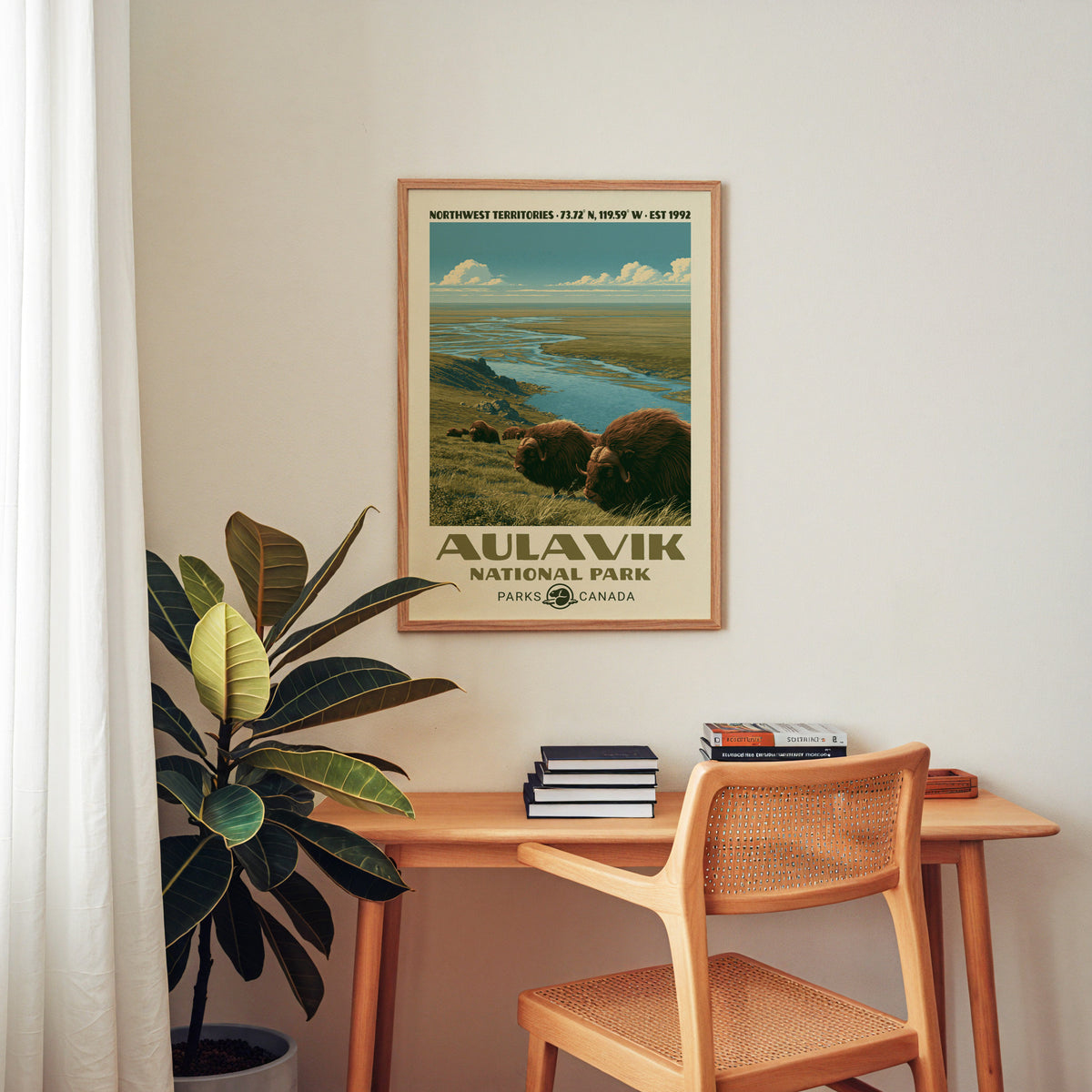 Aulavik National Park canvas print in an oak frame above a wood desk with a cane chair