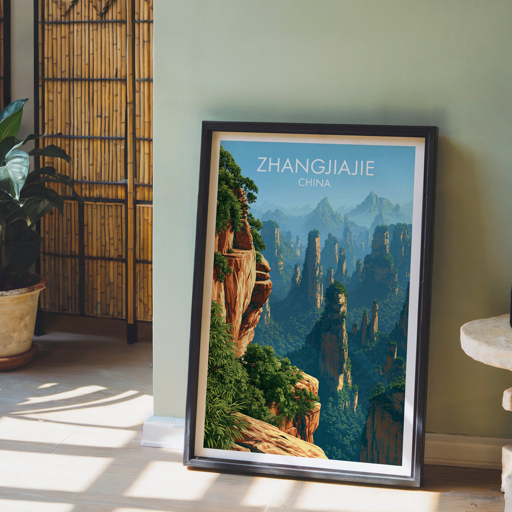 Zhangjiajie China wall art in a black frame leaning against a sage green wall beside a bamboo screen