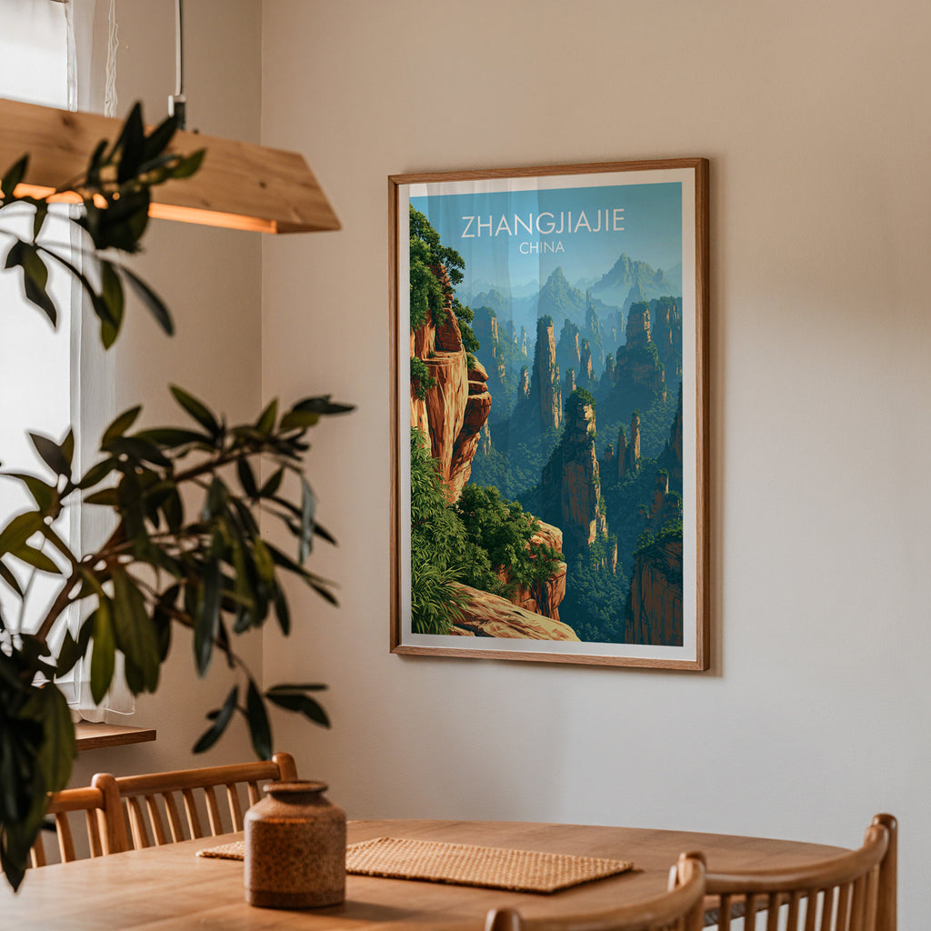 Framed Zhangjiajie China print on a dining room wall above an oak table in warm afternoon light