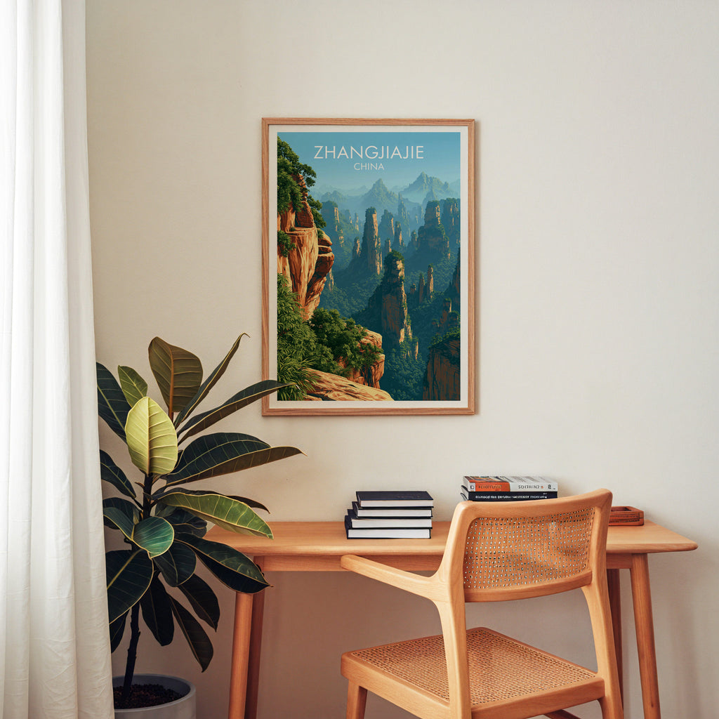 Zhangjiajie China wall art above a wooden home office desk with a rattan chair and books