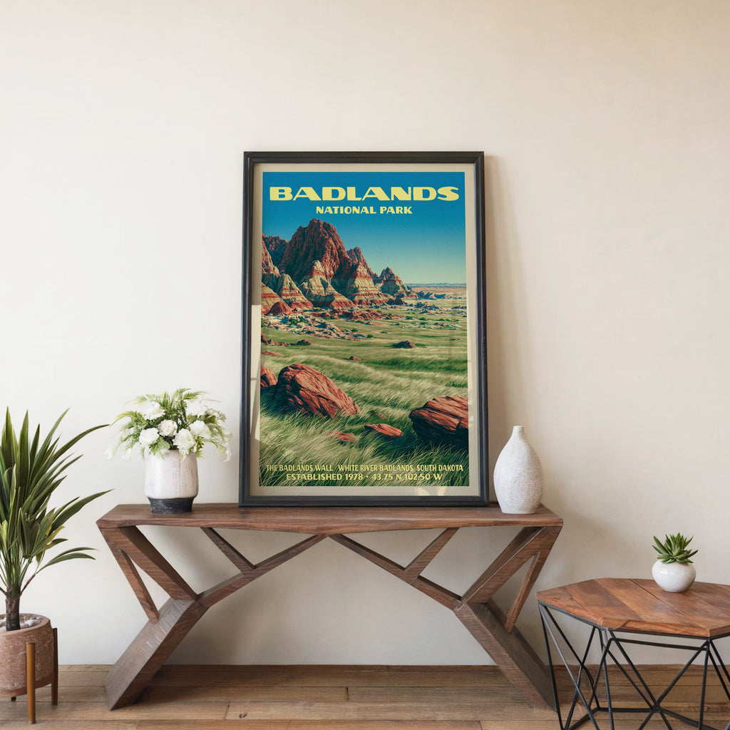 Badlands Wall wall art in black, leaning on a walnut console with white anemones and a white vase