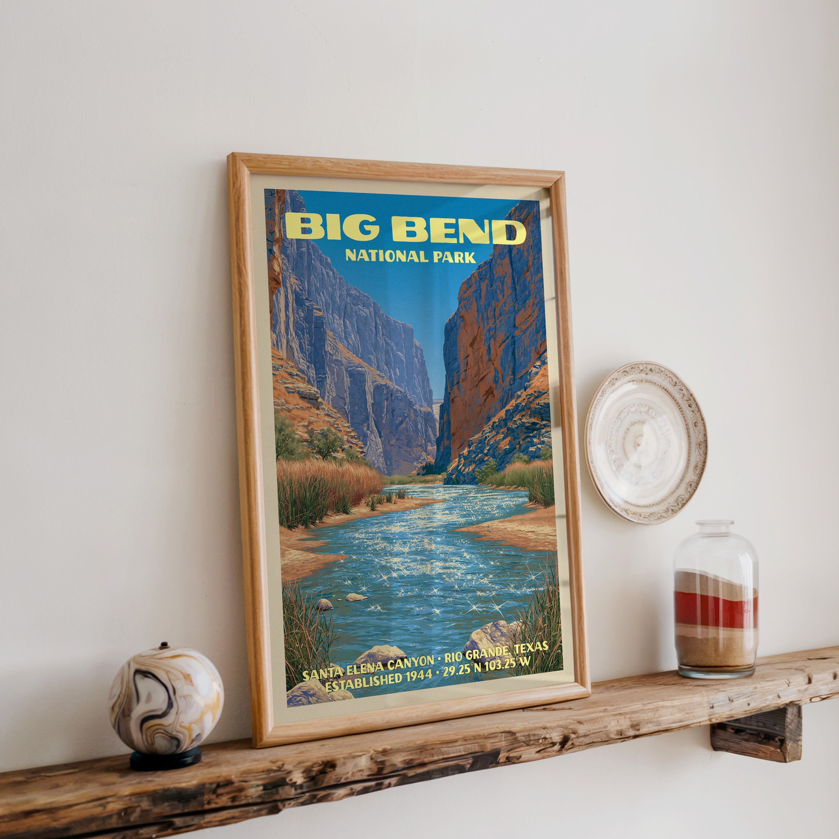 Big Bend Santa Elena Canyon print in oak, leaning on a reclaimed wood ledge with a stone sphere and sand jar