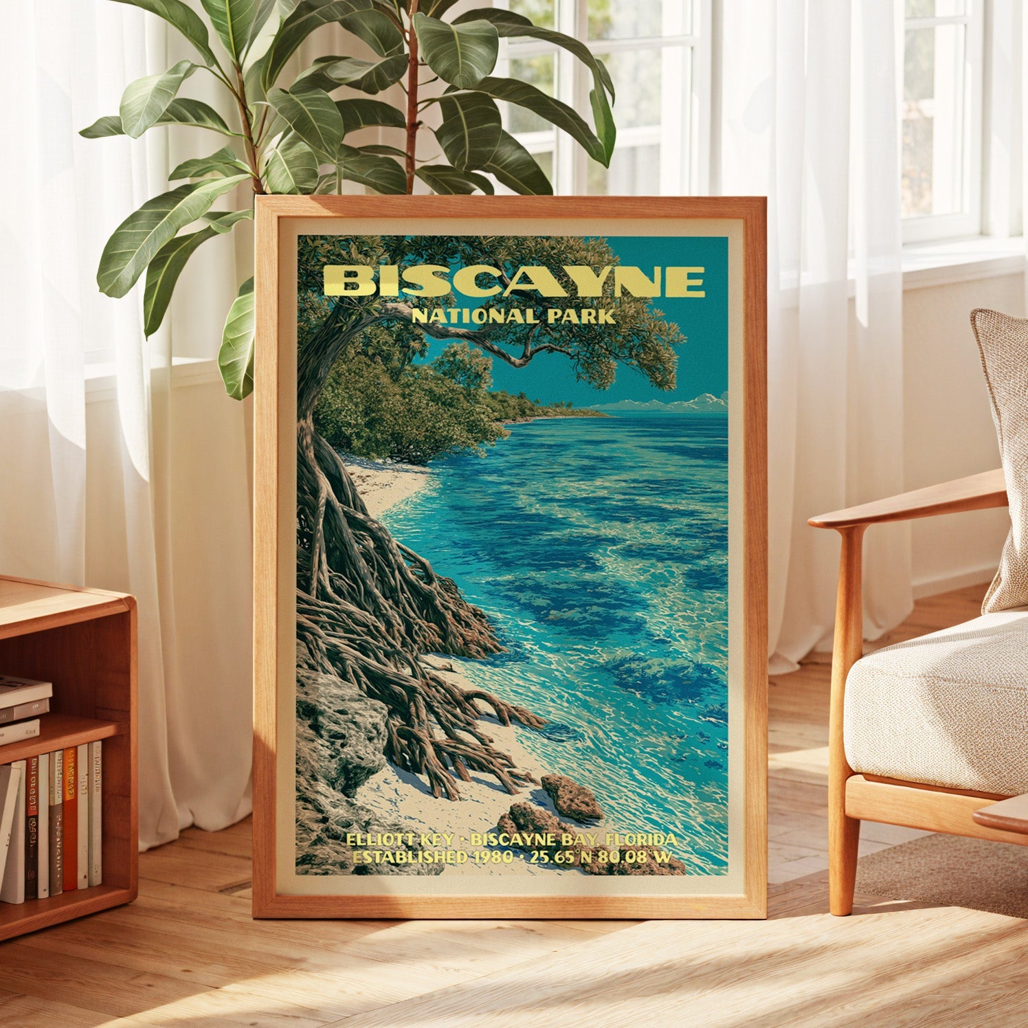 Biscayne vintage poster in oak, leaning by a sunlit window with sheer curtains and a low bookshelf
