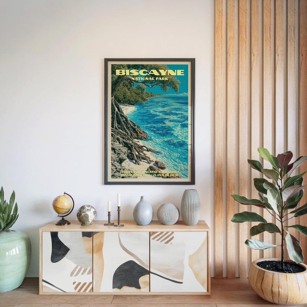 Biscayne National Park poster in a black frame above a light wood sideboard by a slatted wall panel