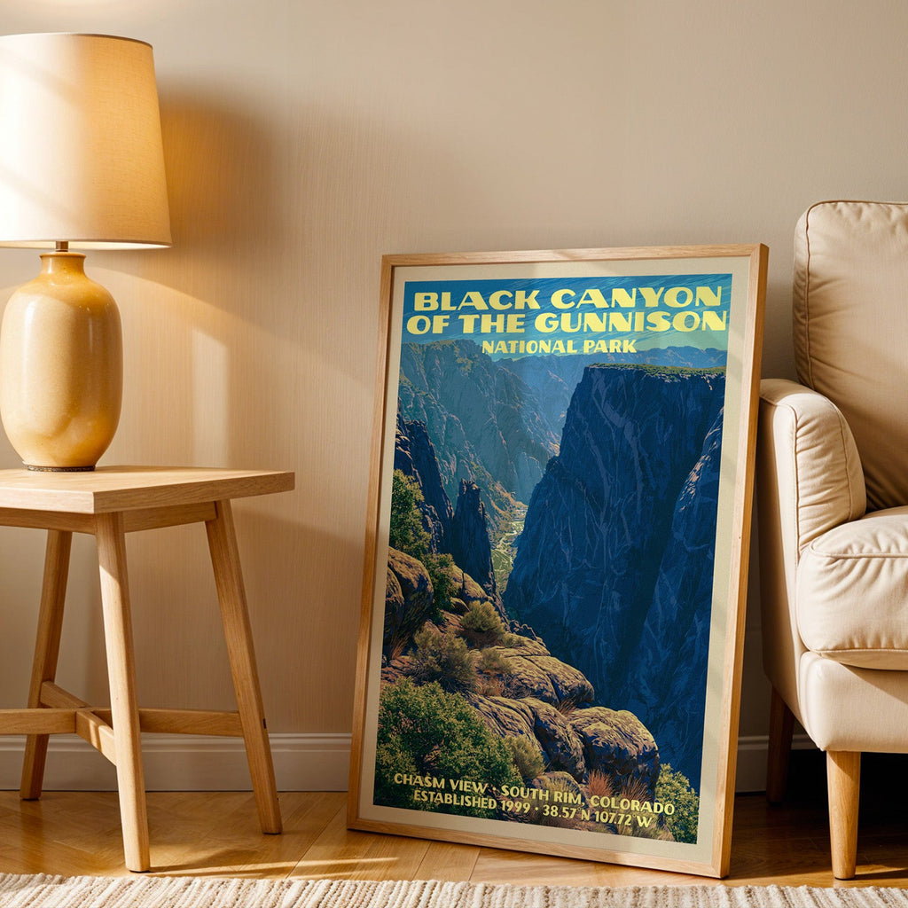 Chasm View Black Canyon wall art in oak, leaning by an armchair and a side table with an ochre lamp