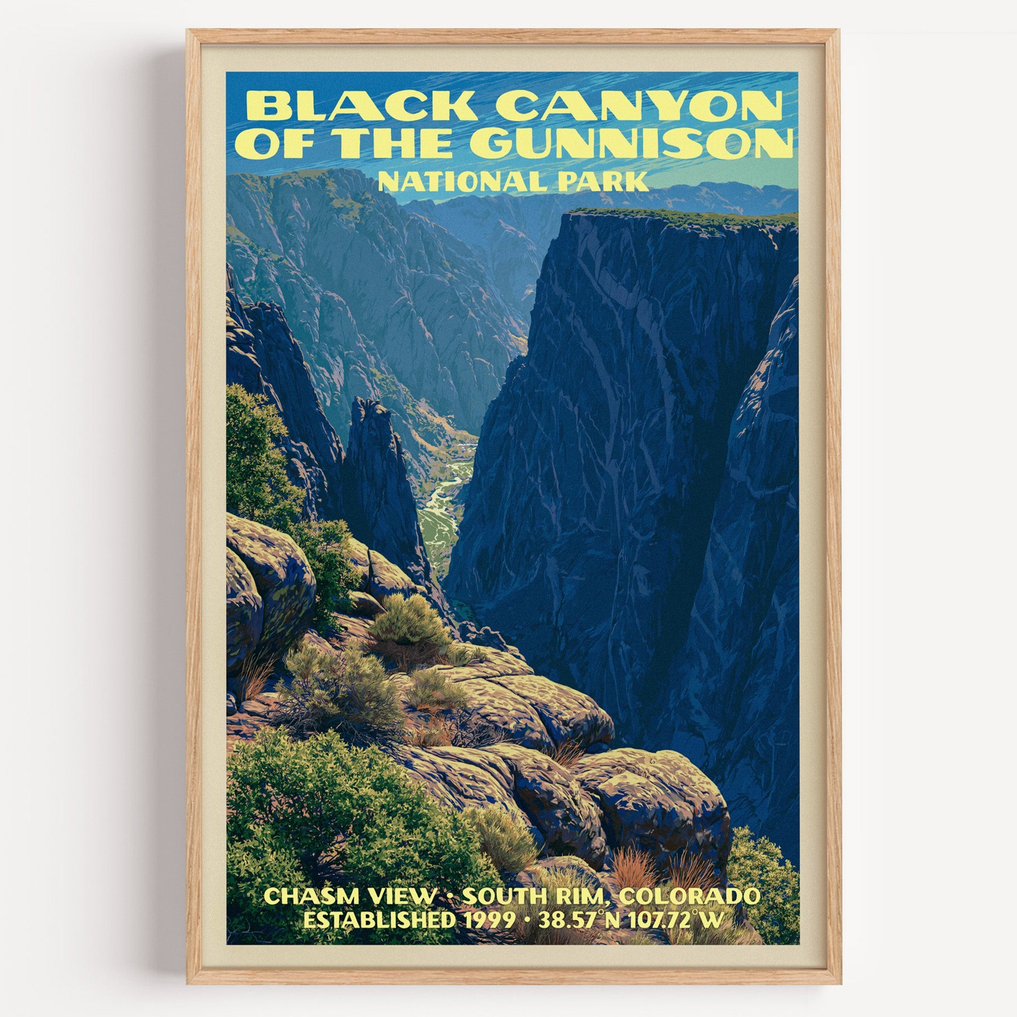 Chasm View Black Canyon of the Gunnison vintage poster in a light oak frame on a plain white wall
