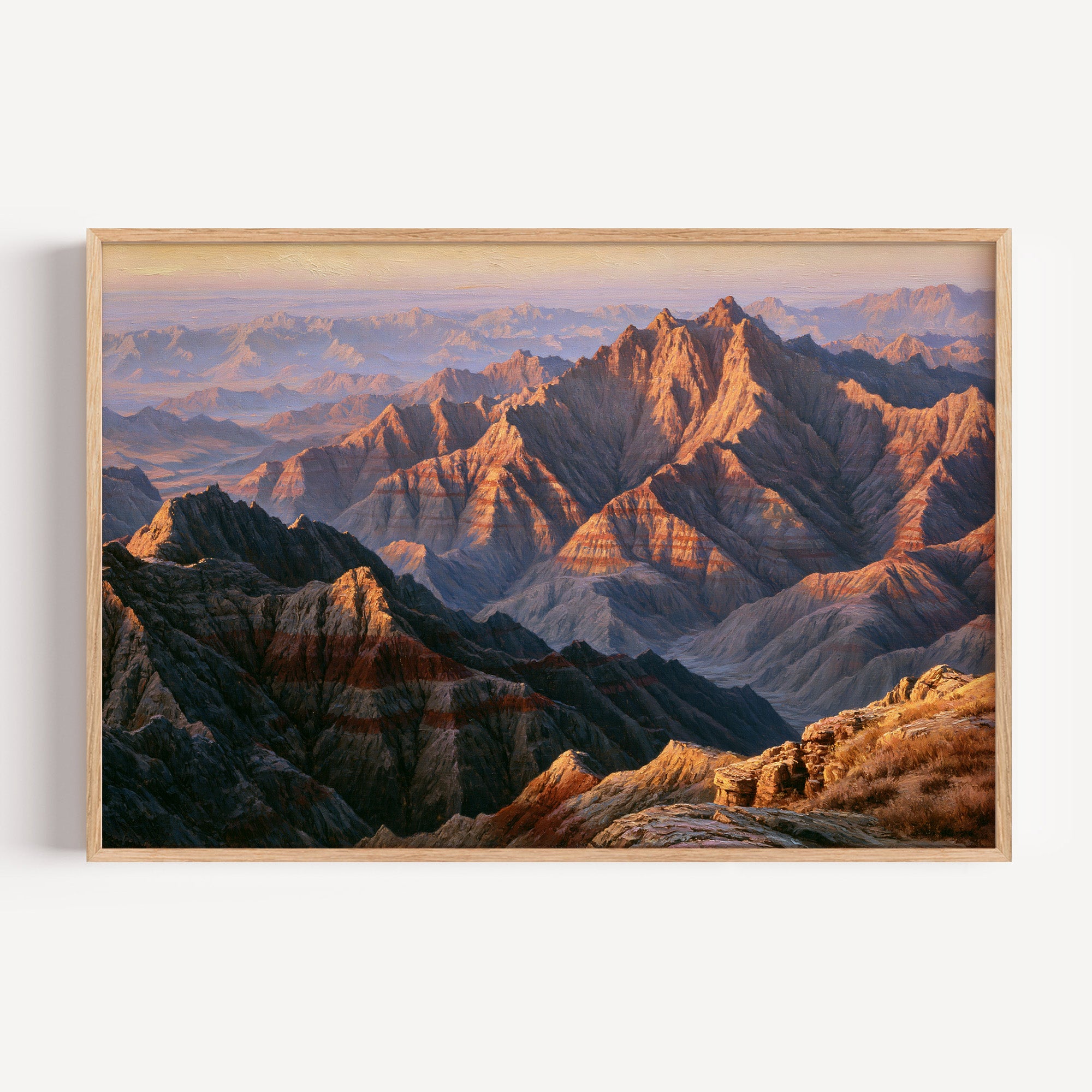 Badlands National Park classical oil painting print in a light oak frame: pink and gold spires at dawn