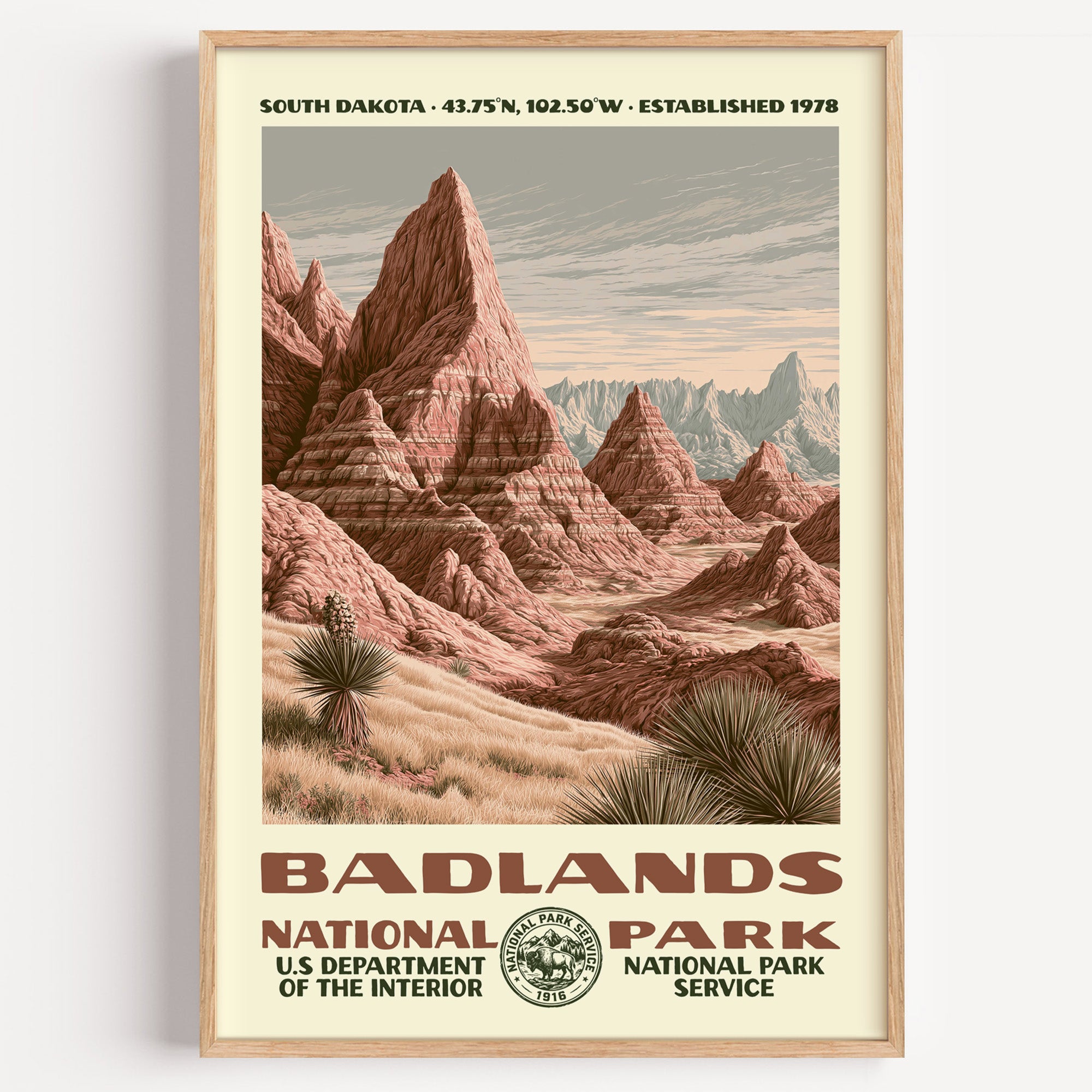 Badlands National Park vintage WPA poster in a wood frame, banded sandstone spires rising out of the prairie
