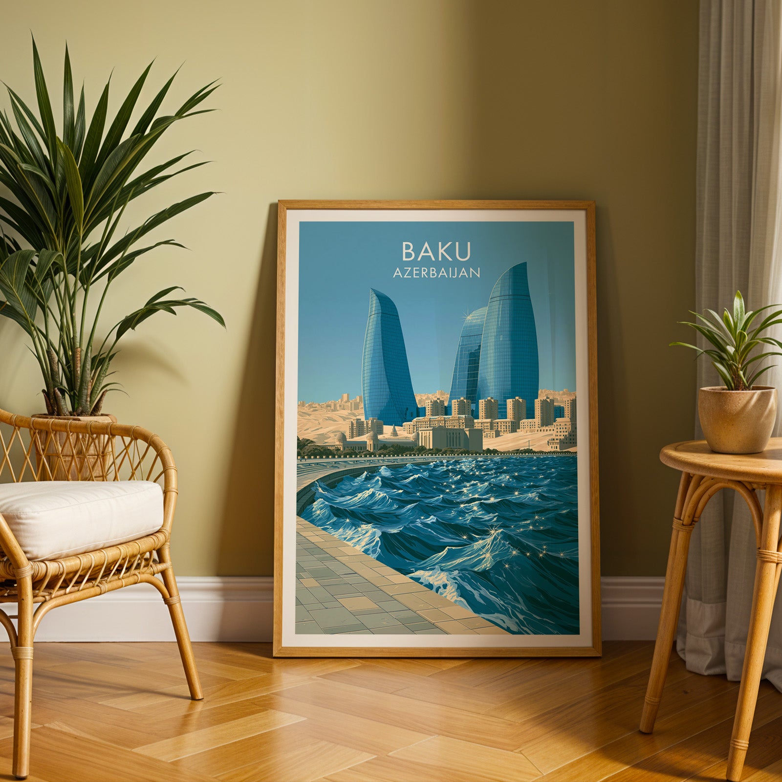 Large Baku Azerbaijan travel print in an oak frame leaning on a herringbone floor next to a rattan chair