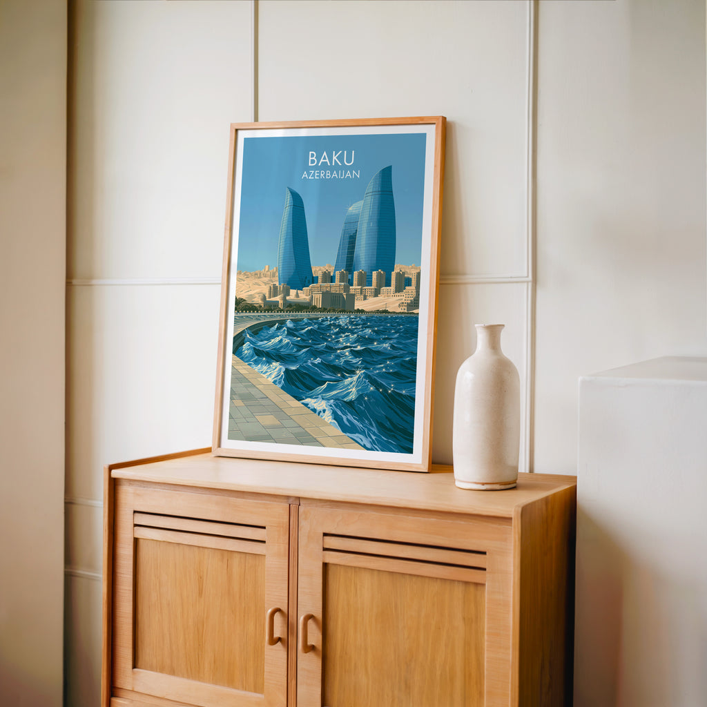 Small Baku Azerbaijan travel poster in an oak frame on a mid-century sideboard with a ceramic vase