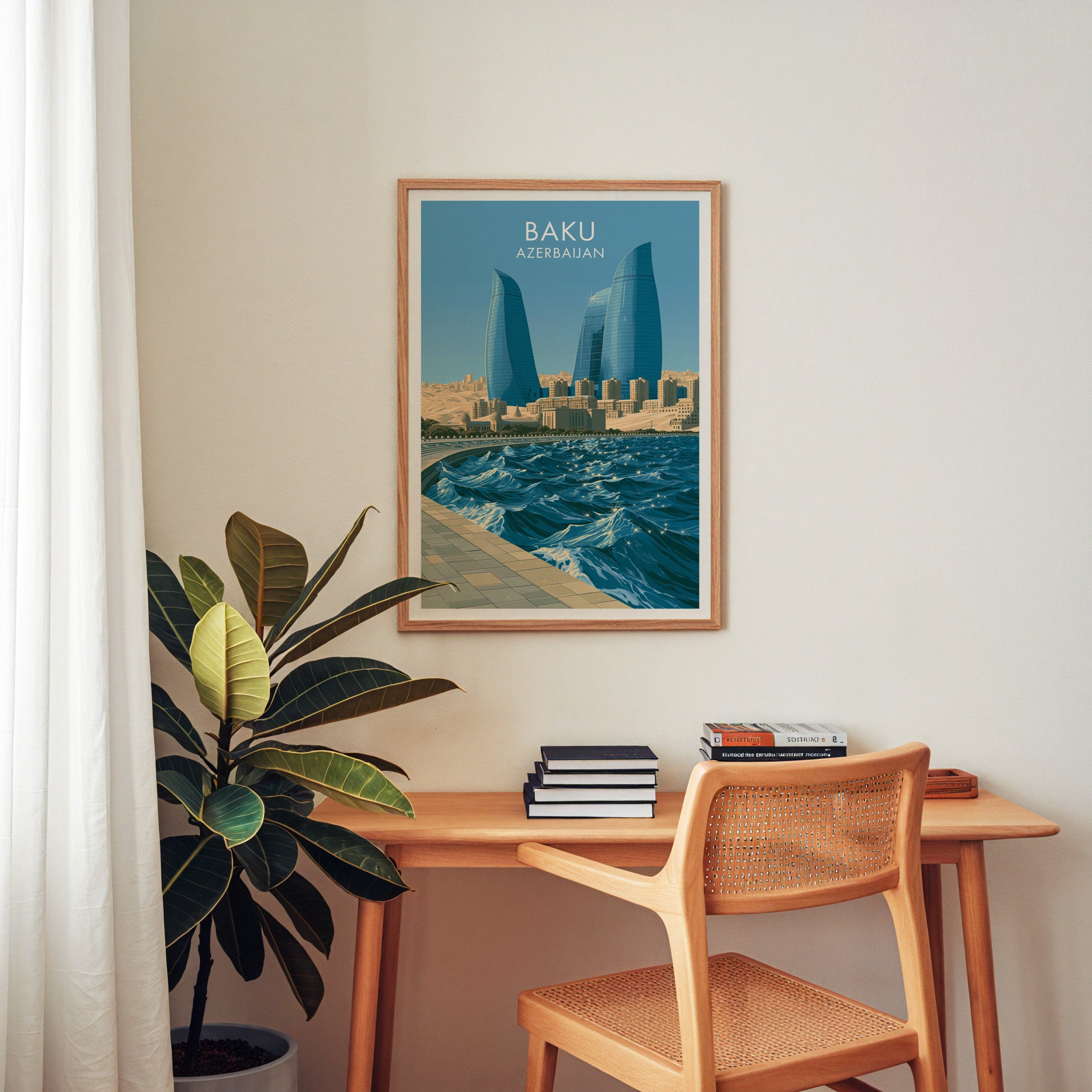 Baku Azerbaijan wall art above a wooden home office desk with a rattan chair and books