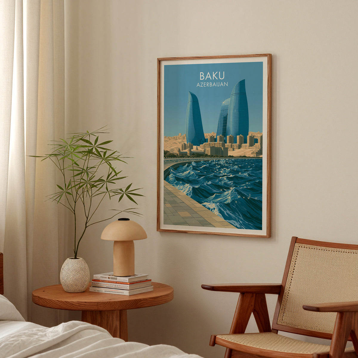 Baku Azerbaijan travel poster in an oak frame above a round bedside table with a mushroom lamp and bamboo stems