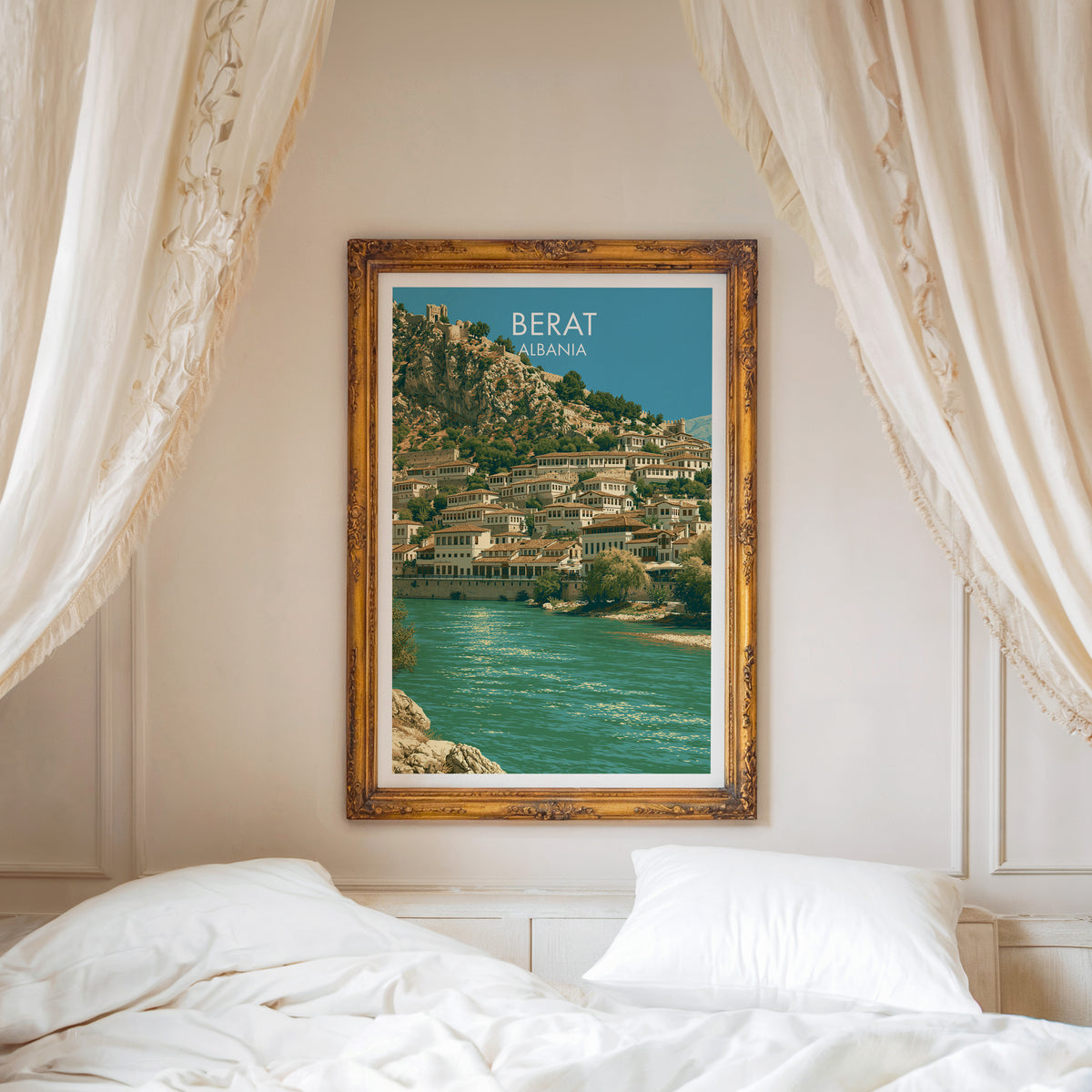 Berat travel poster, ornate gold frame above a white bed with linen canopy curtains