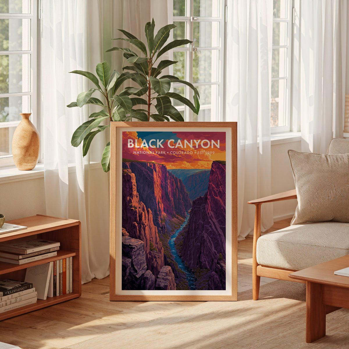Black Canyon of the Gunnison National Park mid-century modern art print leaning in a sun-filled living room beside an armchair — living room wall art