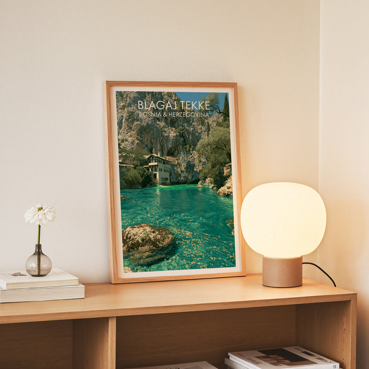 Blagaj Tekke wall art, slim oak frame standing on an oak console beside a daisy in a glass bottle