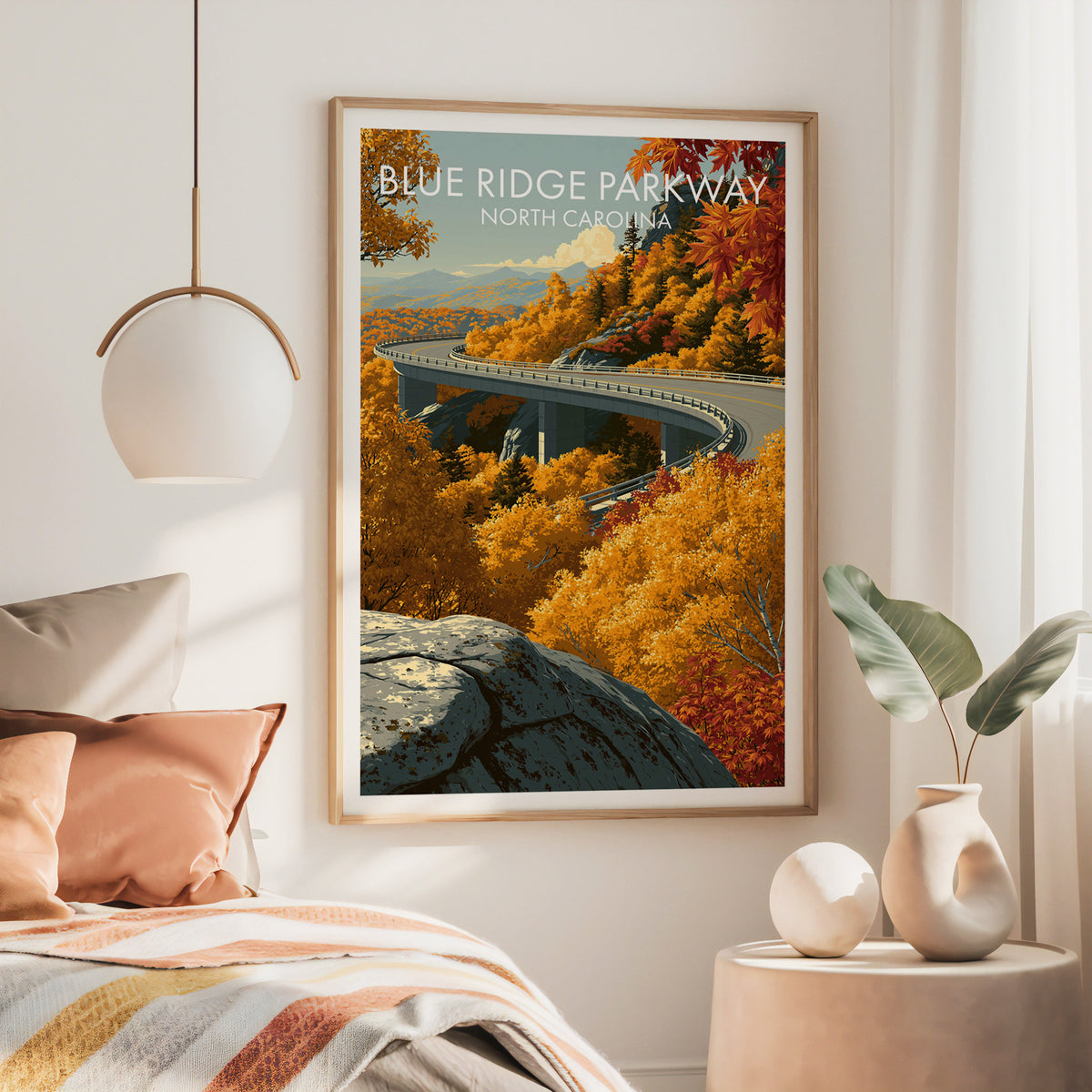 Blue Ridge Parkway canvas art in a large oak frame above a rust iron bed under a brass pendant lamp
