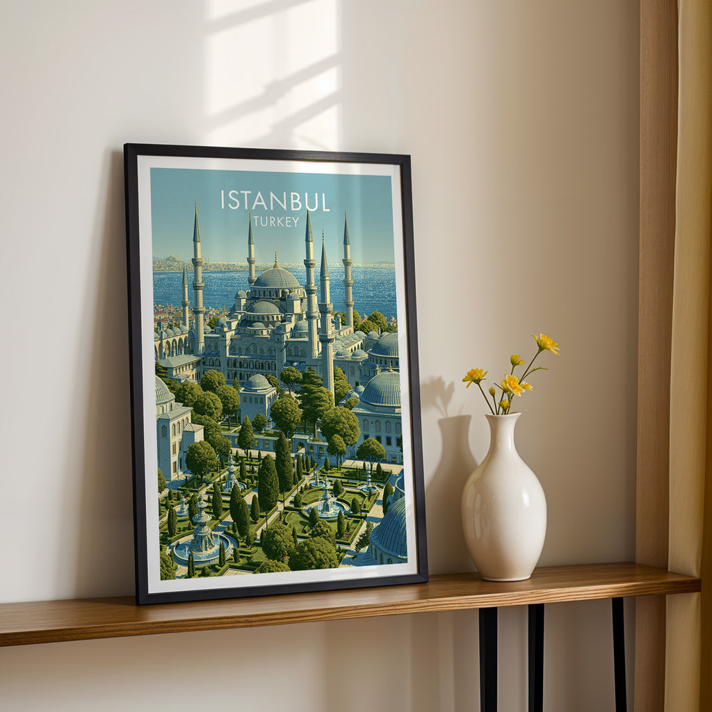 Black framed Blue Mosque Istanbul Turkey print on a narrow hallway console in sunlight, styled with yellow flowers